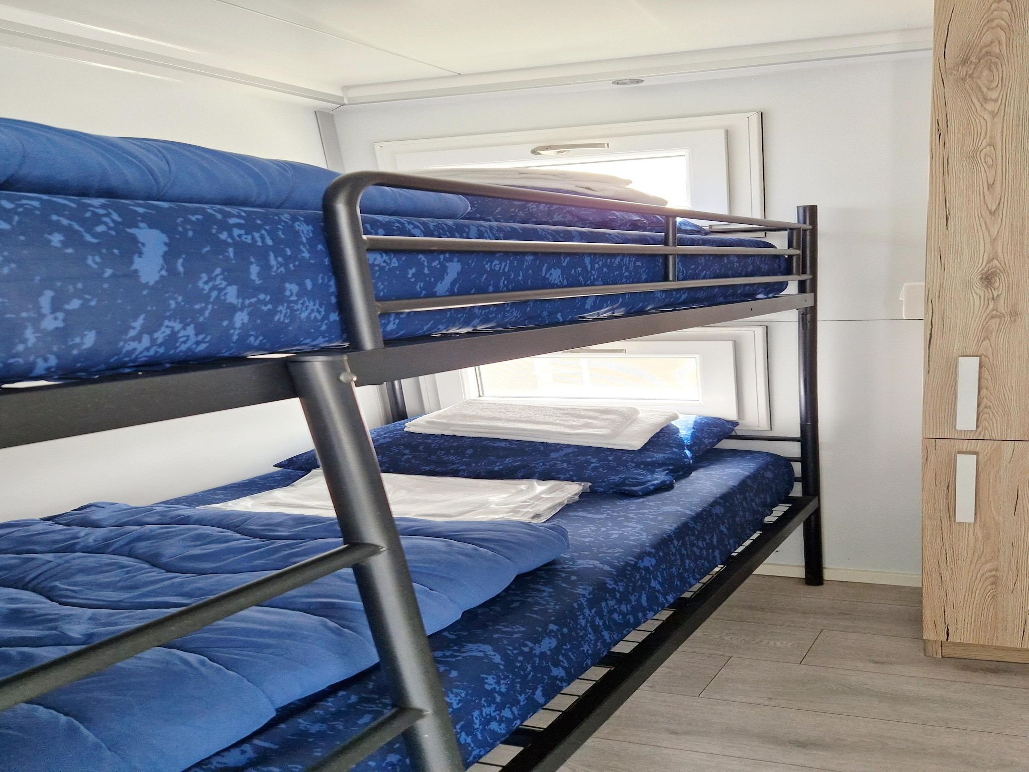 Een slaapkamer van Havenlodges Naarden 1 in Naarden