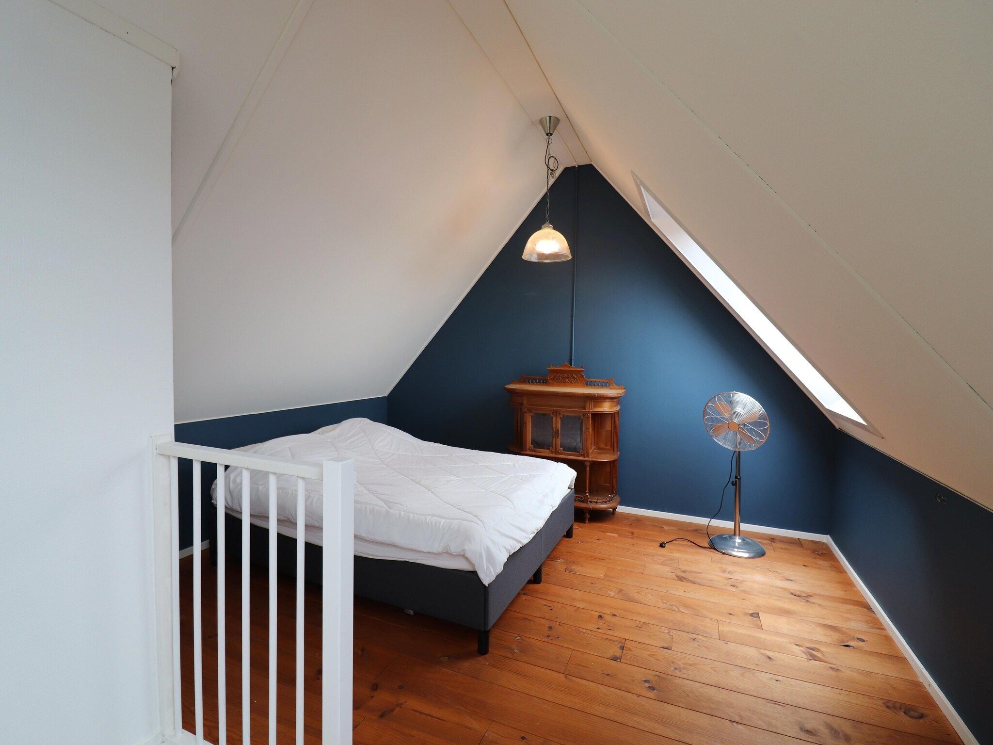 Een slaapkamer van Vakantiehuis in zonnig Grou in Gou