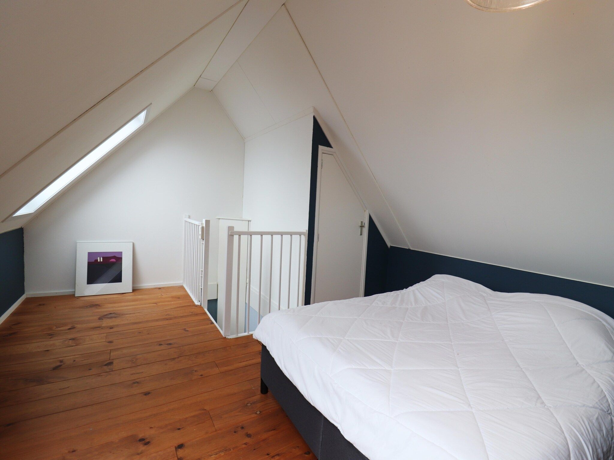 Een slaapkamer van Vakantiehuis in zonnig Grou in Gou