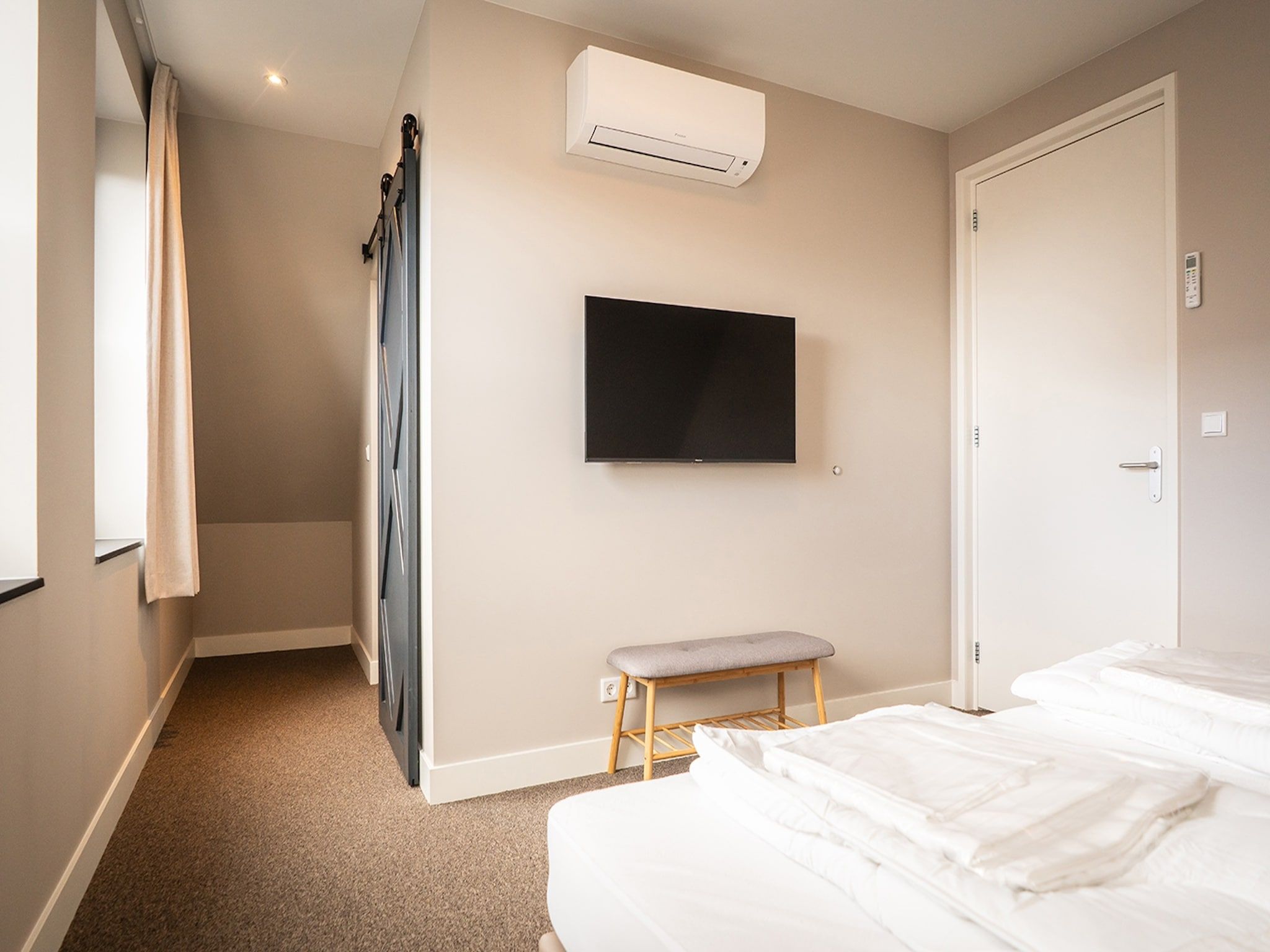 Een slaapkamer van Vakantiepark 't Eibernest Texel 8 in De Cocksdorp