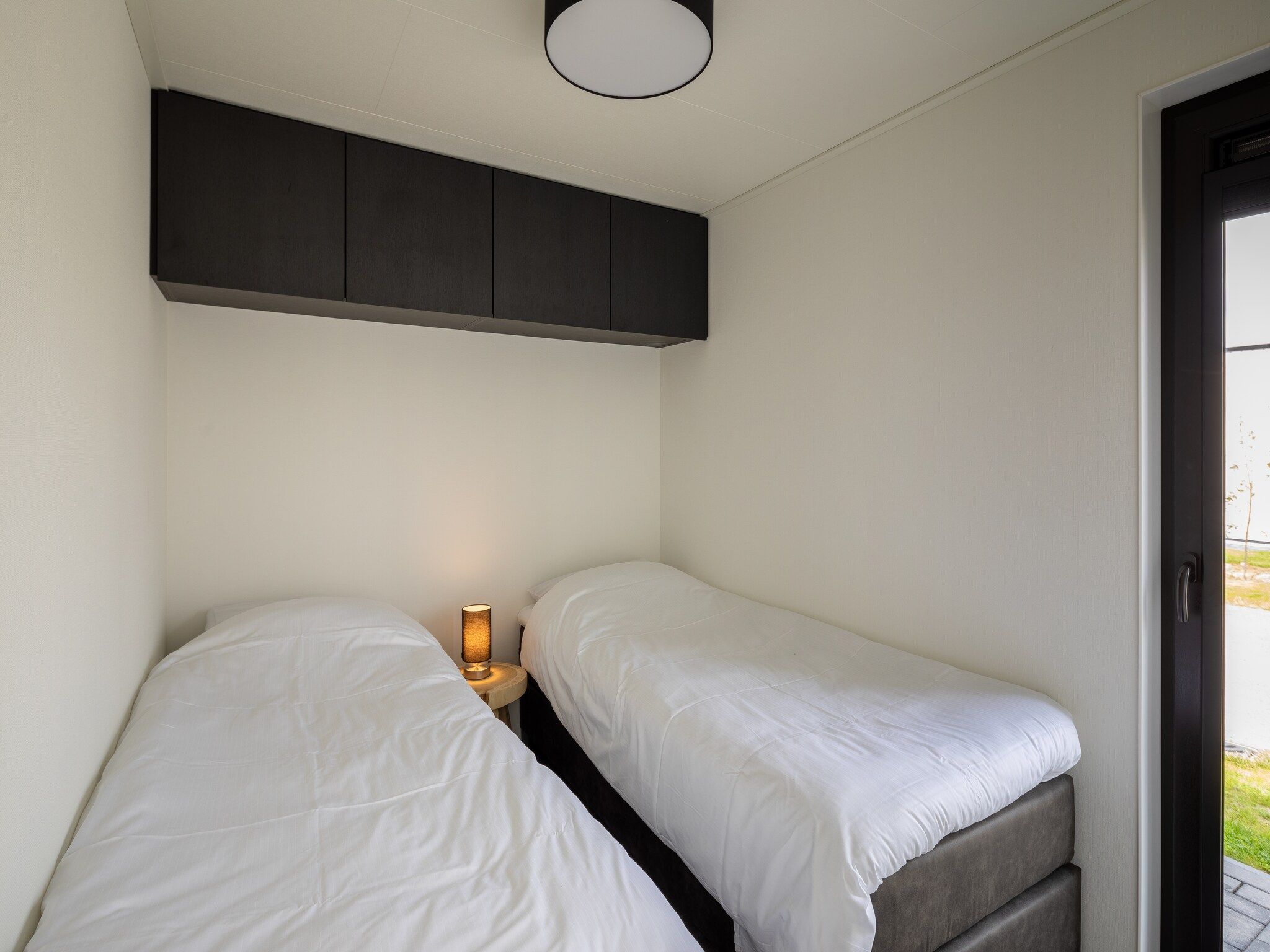 Een slaapkamer van Vakantiepark Zeedijk 5 in Herkingen