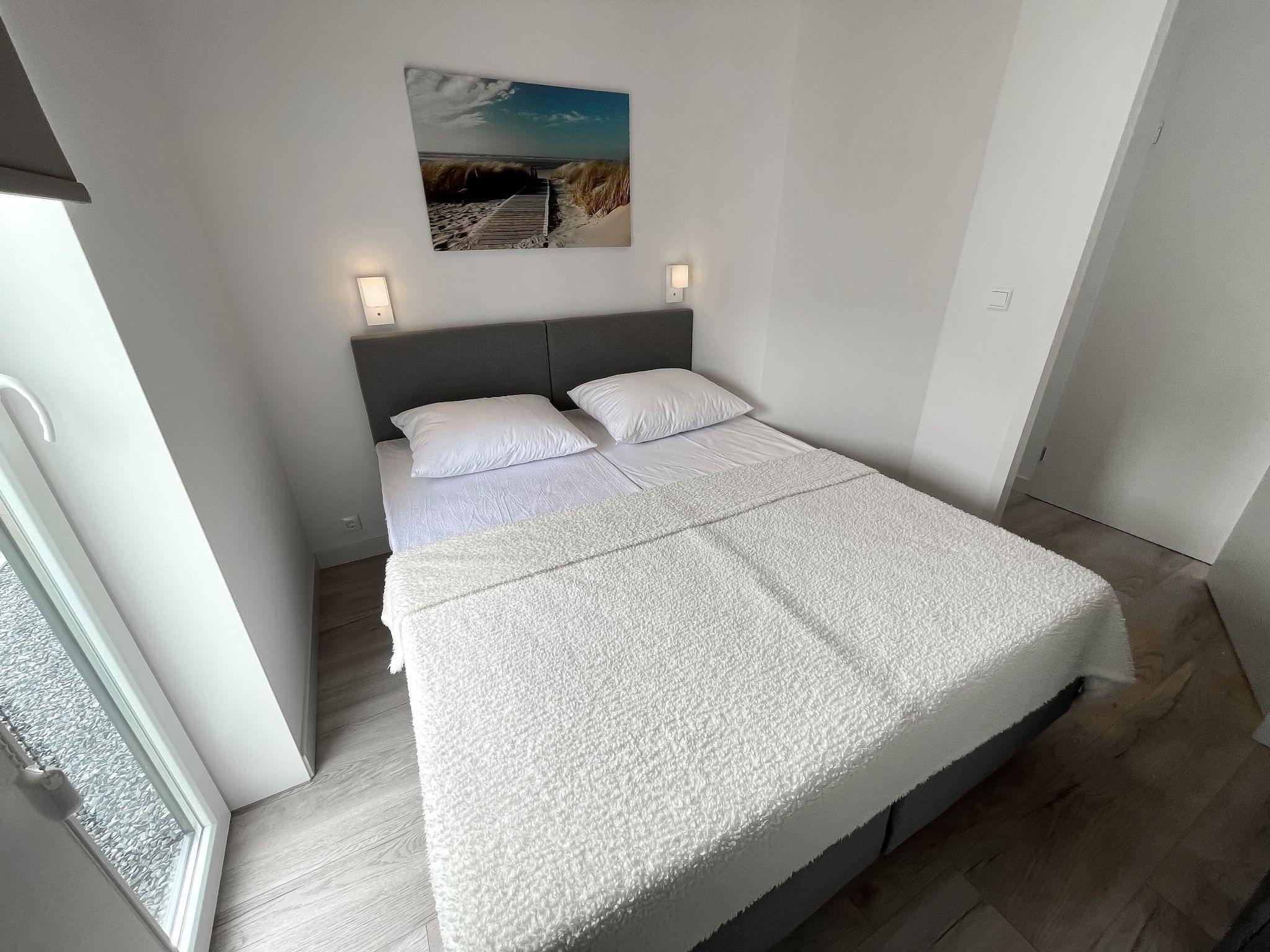 Een slaapkamer van Water Resort Oosterschelde 83 in Wemeldinge