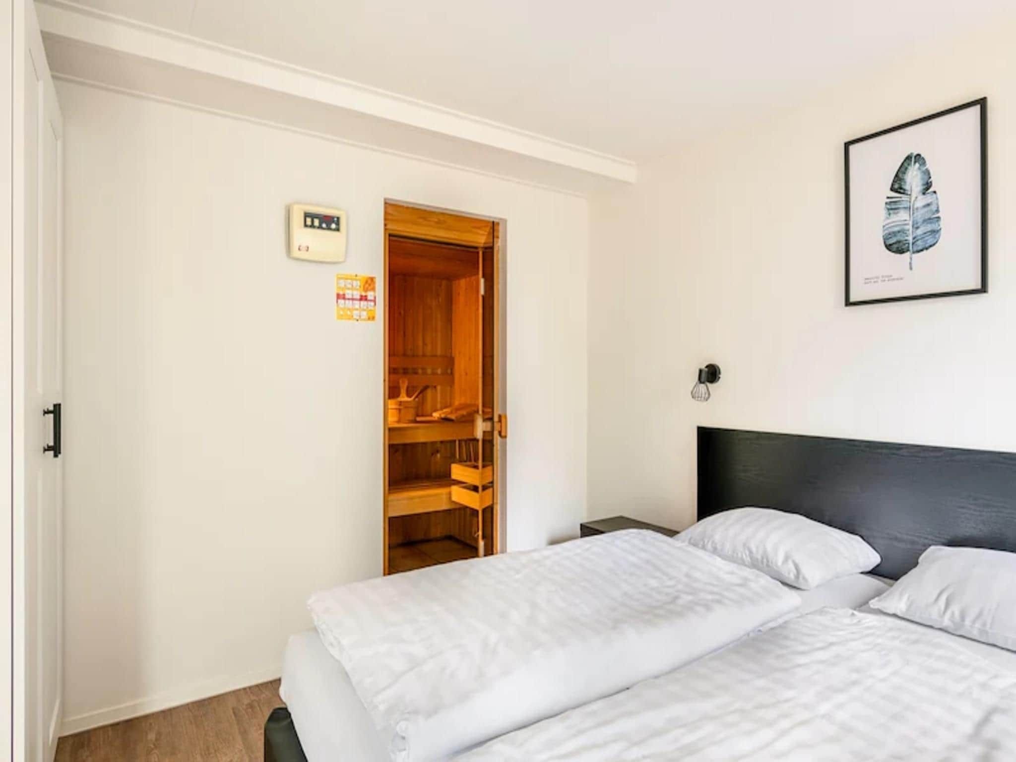 Een slaapkamer van Vakantiepark de Berkenhorst 17 in Kootwijk