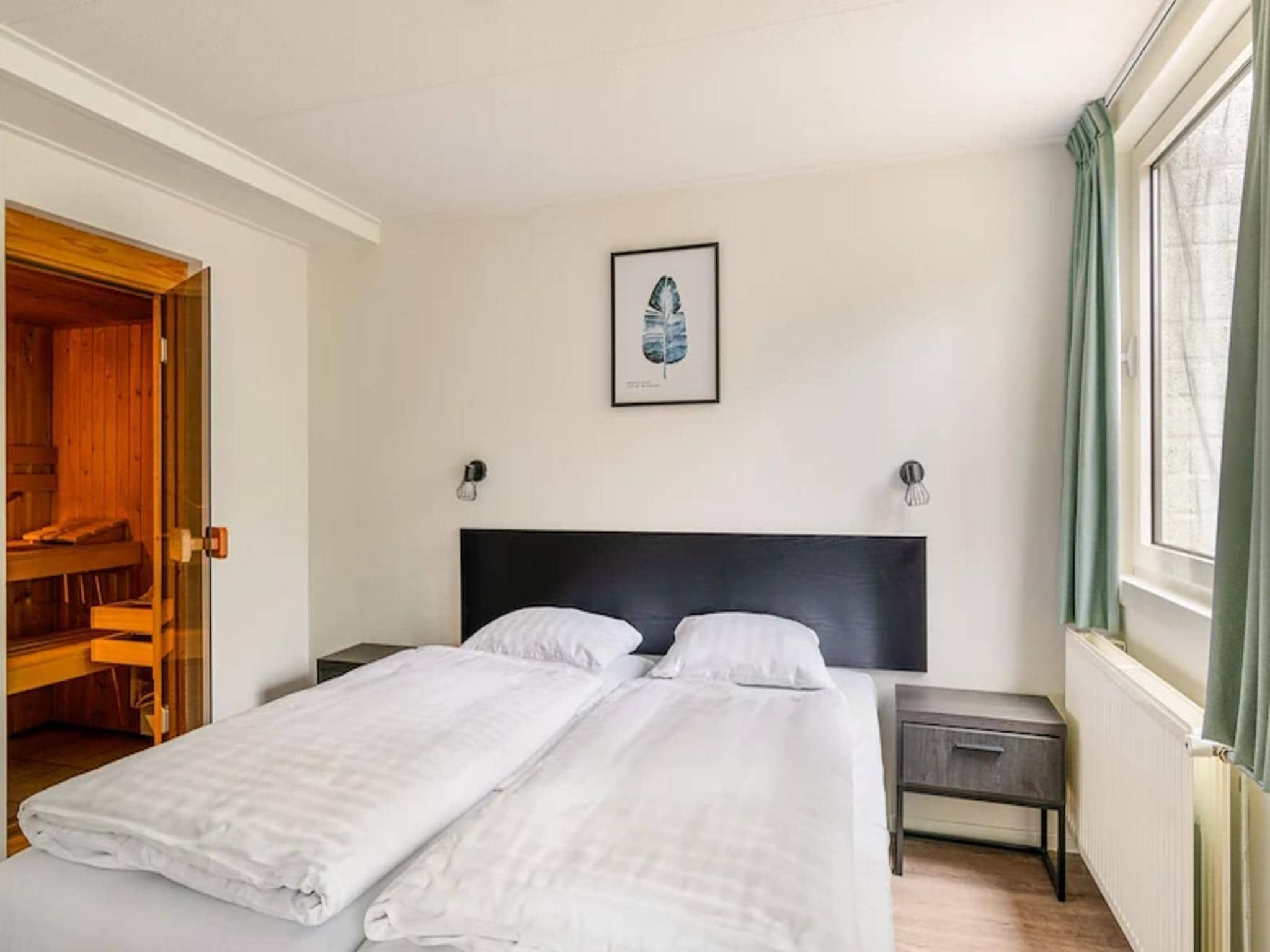 Een slaapkamer van Vakantiepark de Berkenhorst 17 in Kootwijk