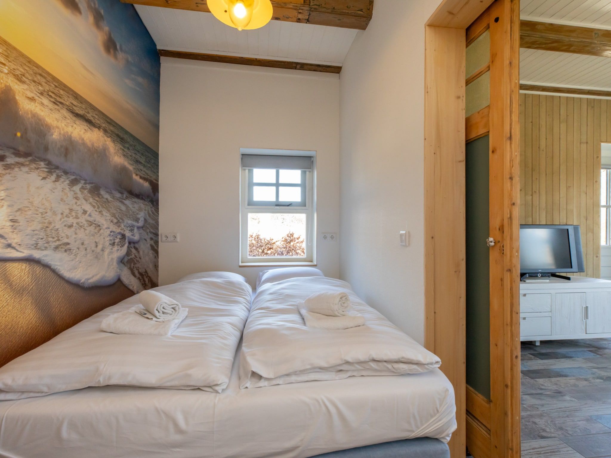 Een slaapkamer van Verkorte Groeneweg 2 in Koudekerke