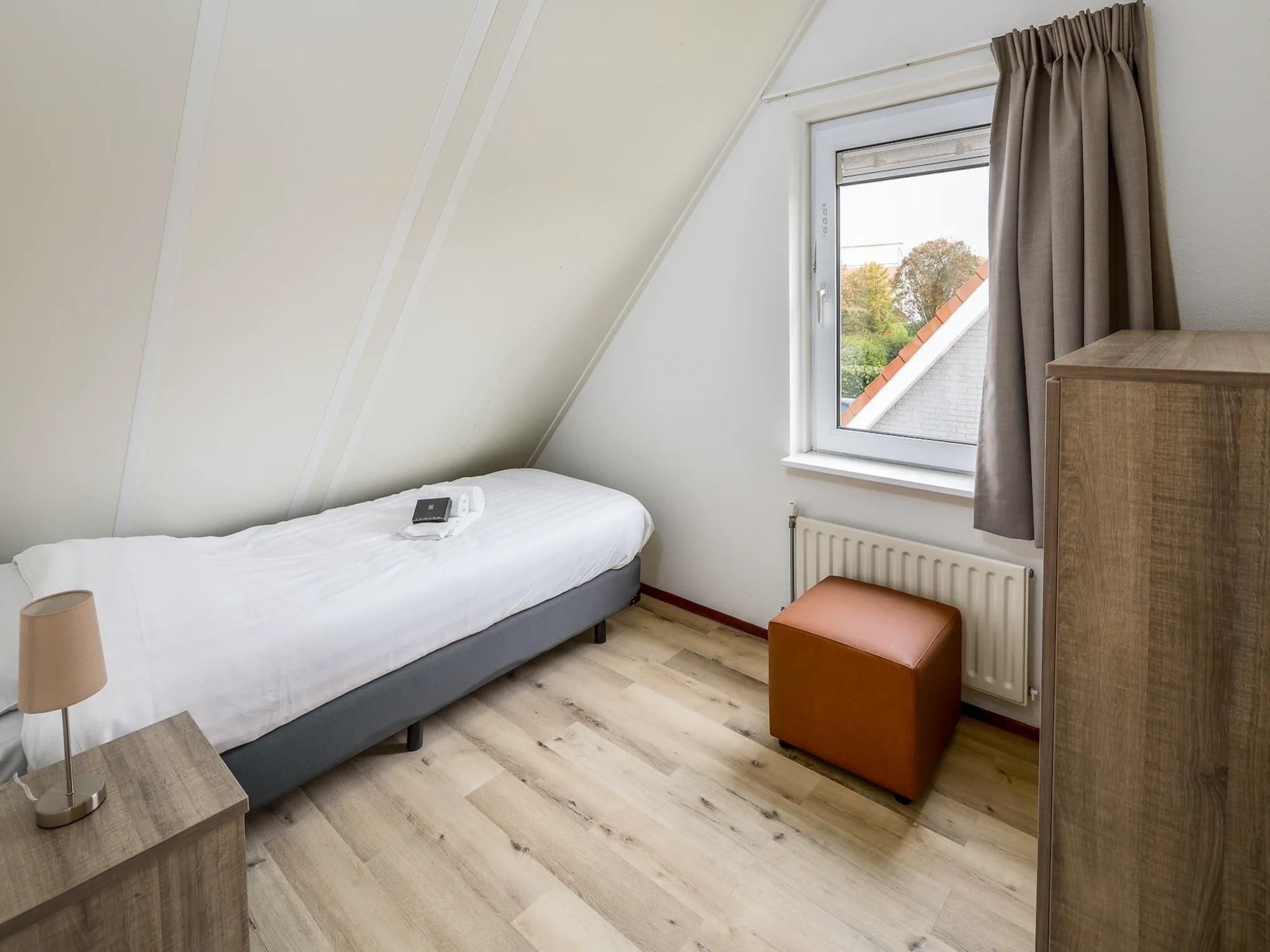 Een slaapkamer van Vakantiepark Zeeland Village 5 in Scharendijke