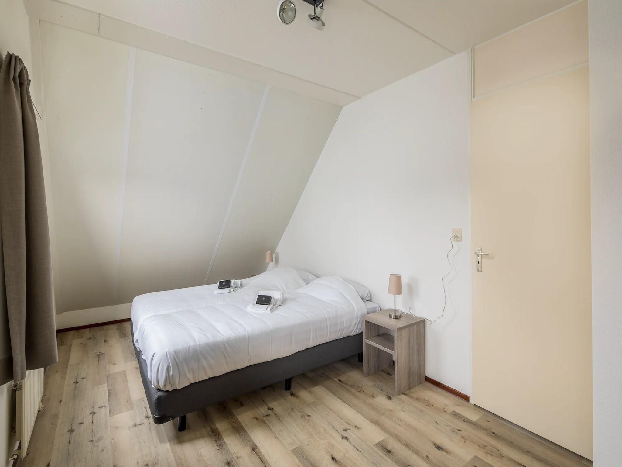 Een slaapkamer van Vakantiepark Zeeland Village 5 in Scharendijke