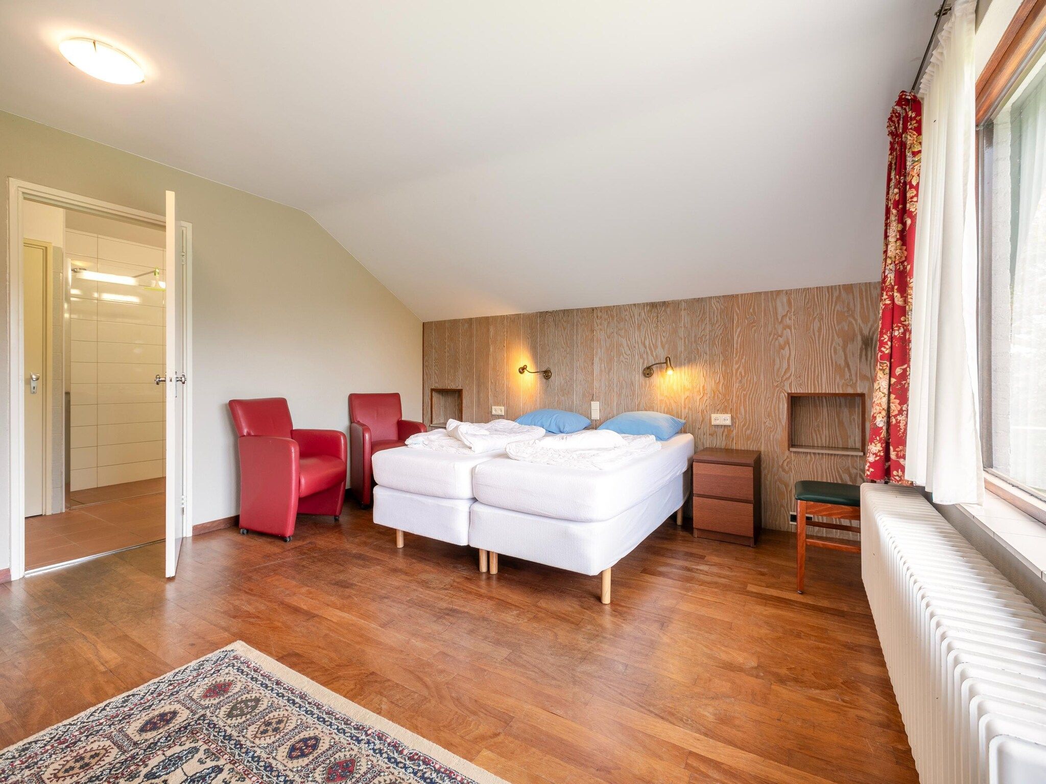 Een slaapkamer van Vakantiepark Herperduin 21 in Herpen