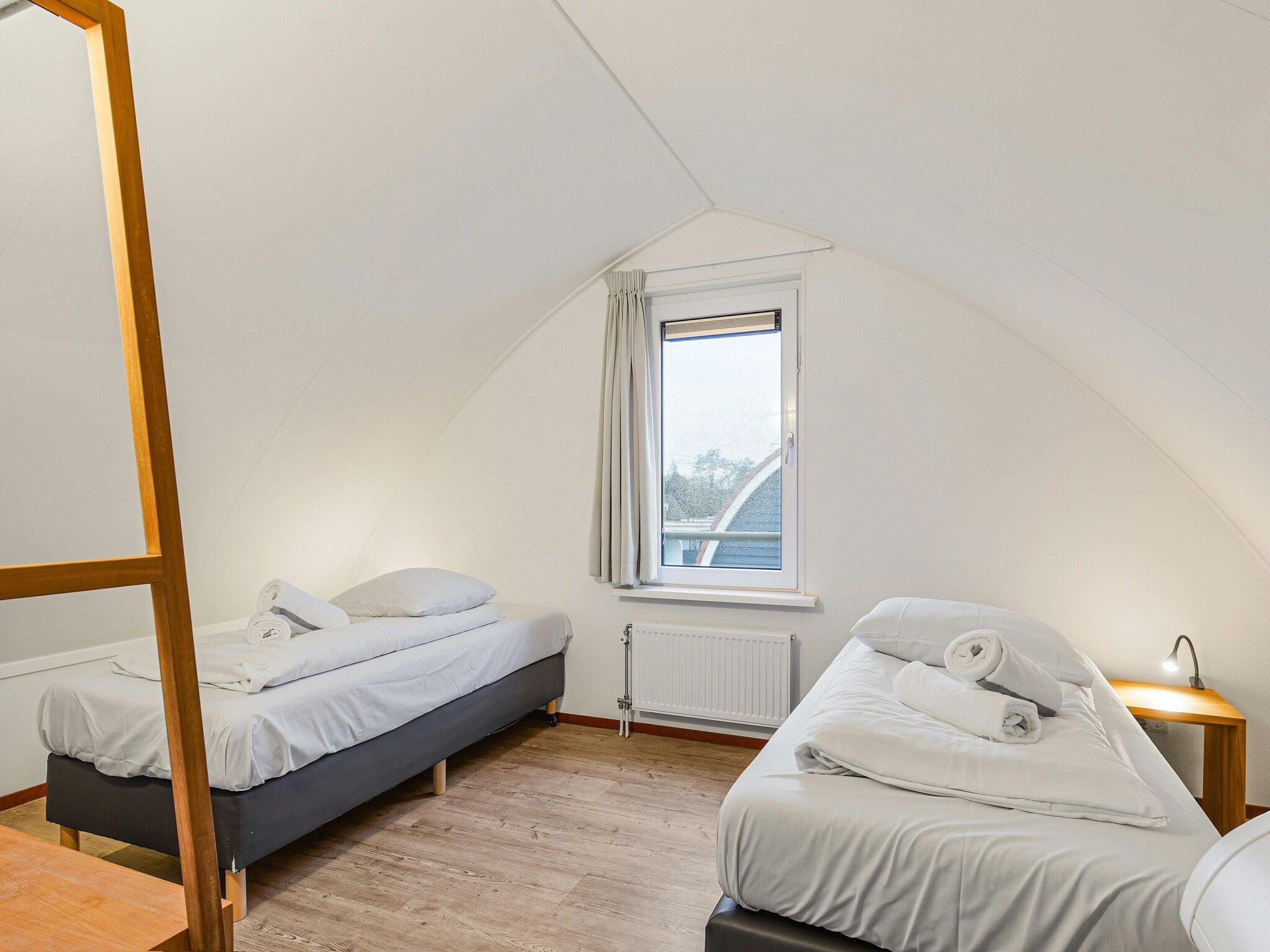 Een slaapkamer van Waterpark De Bloemert 1 in Midlaren
