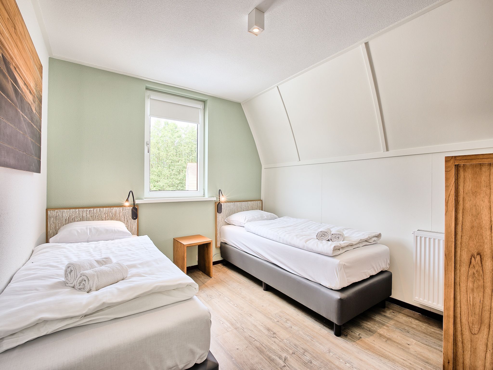 Een slaapkamer van Waterpark De Bloemert 19 in Midlaren