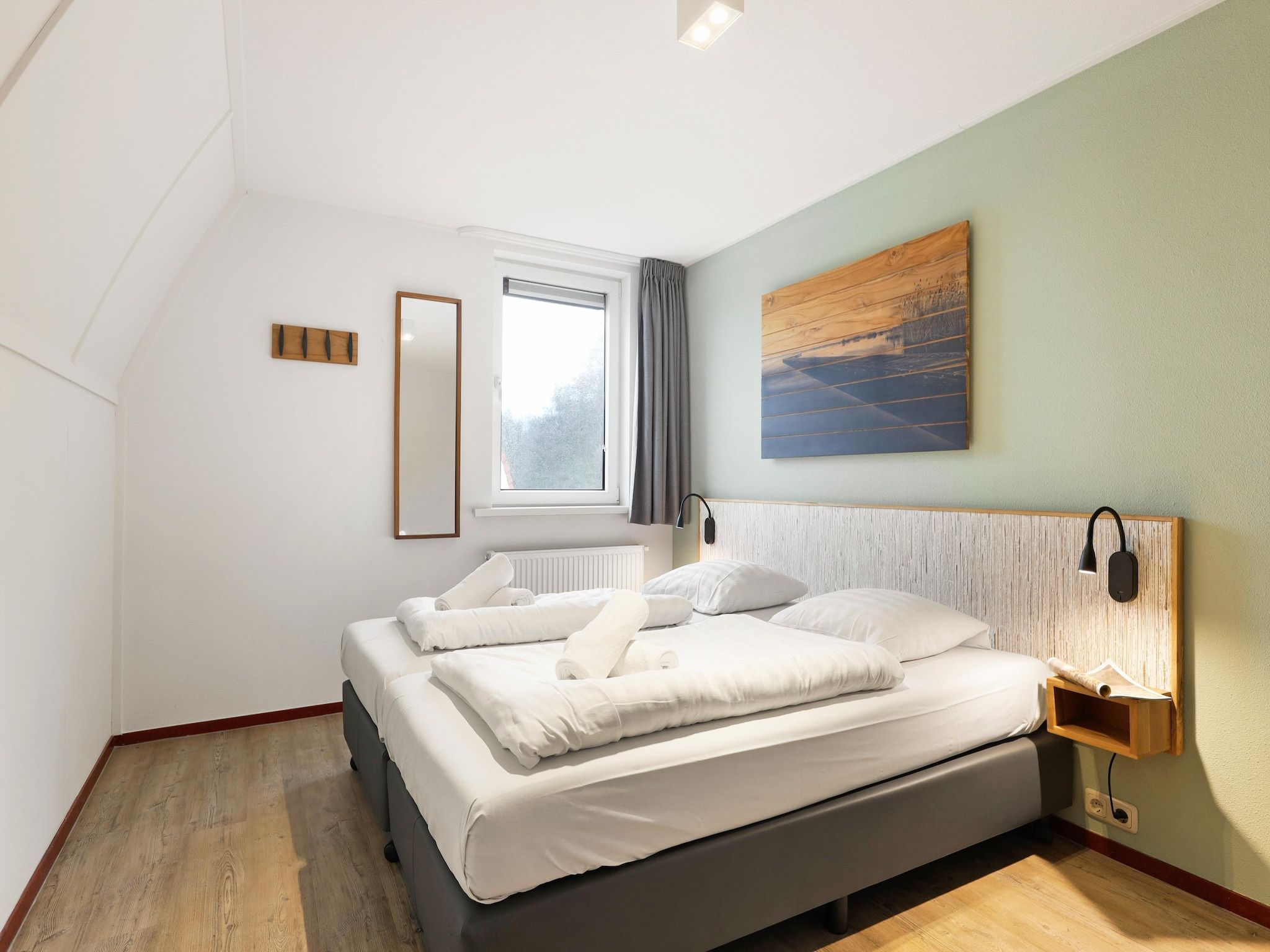 Een slaapkamer van Waterpark De Bloemert 19 in Midlaren