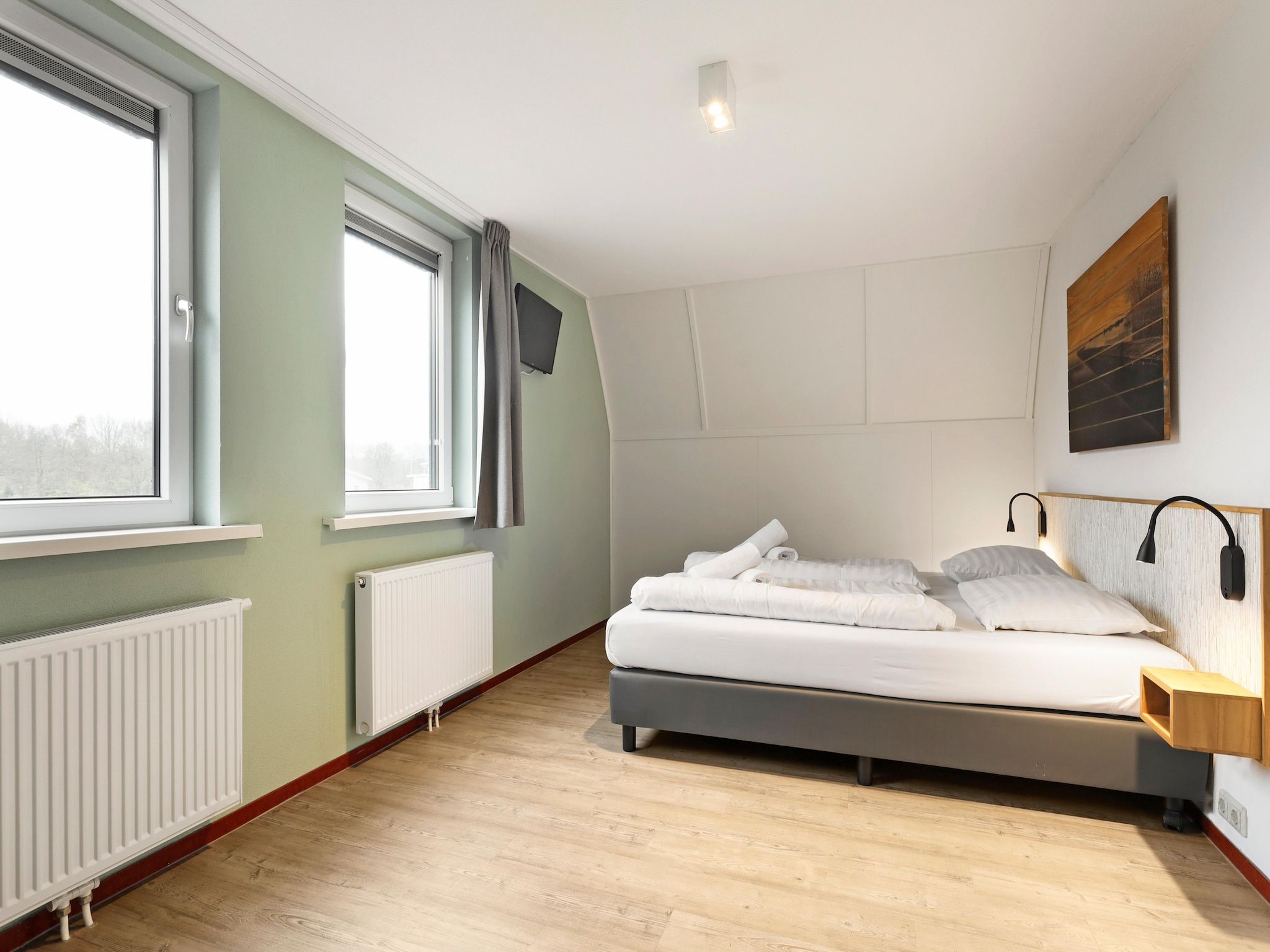 Een slaapkamer van Waterpark De Bloemert 19 in Midlaren