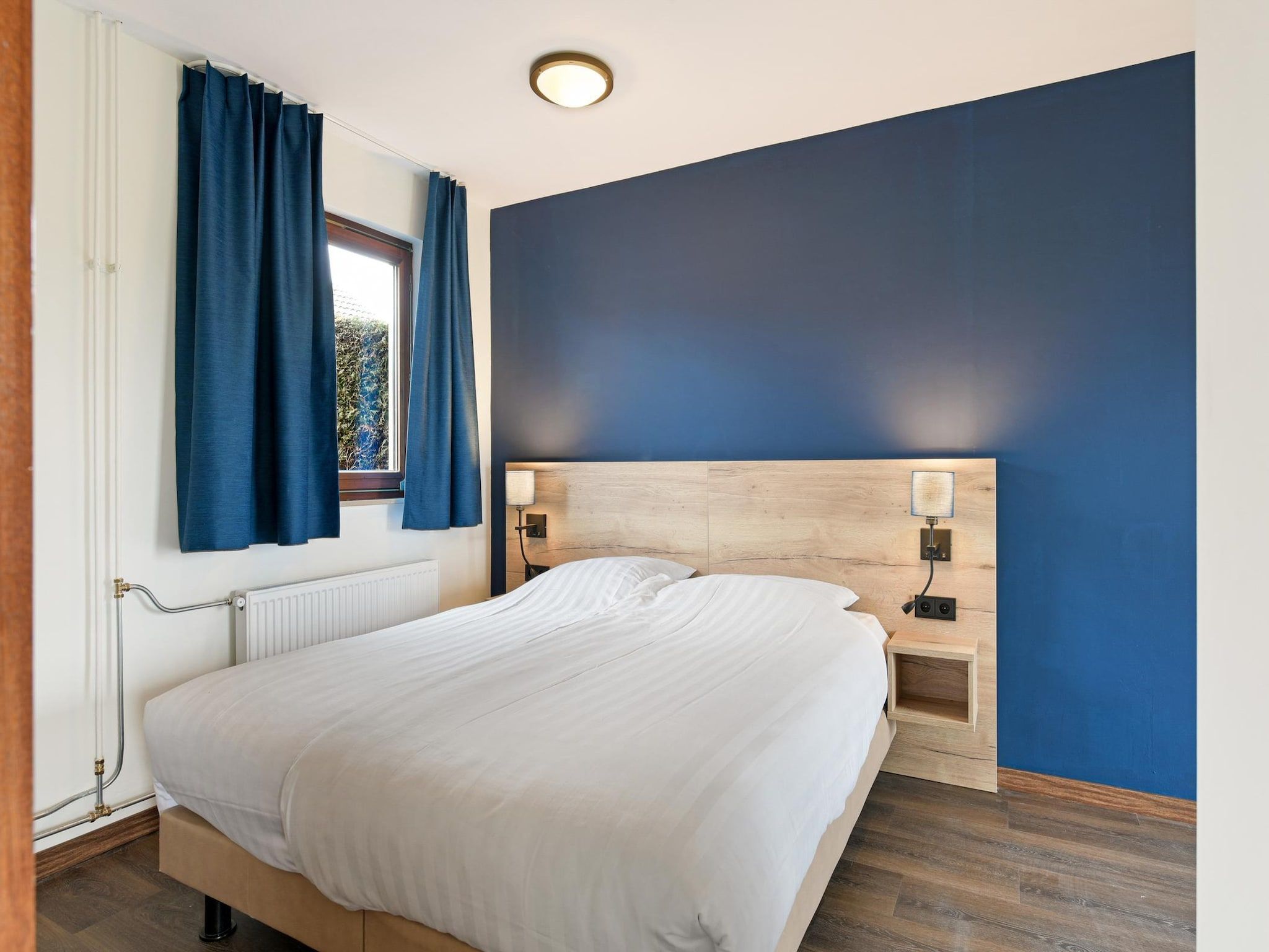 Een slaapkamer van Bungalow 2B in Vijlen