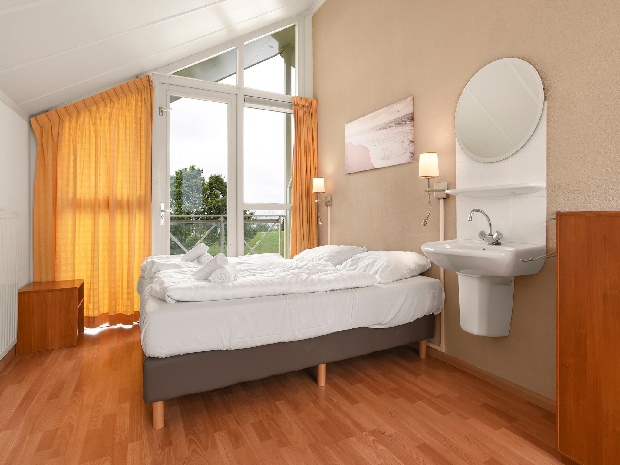 Een slaapkamer van Parc Port Greve 21 in Brouwershaven