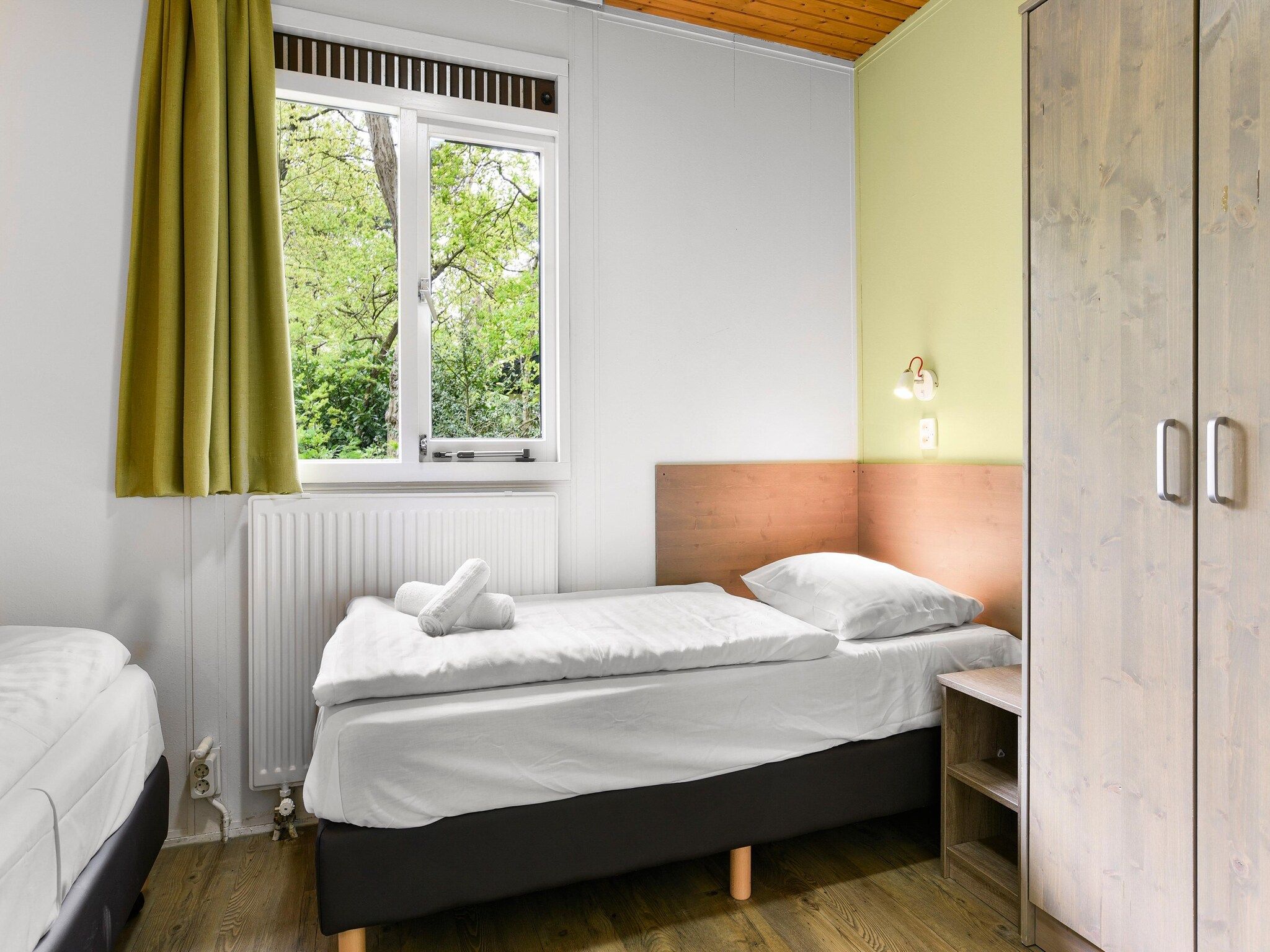 Een slaapkamer van Parc Heihaas 6 in Putten