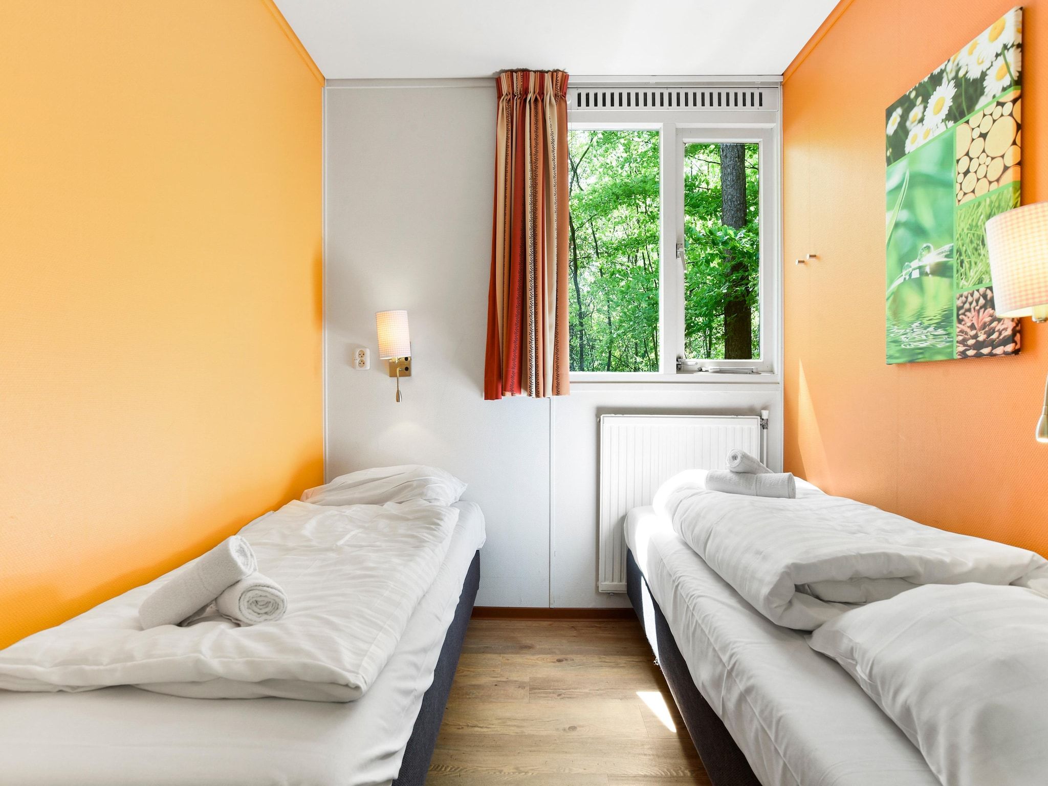 Een slaapkamer van Parc Heihaas 7 in Putten