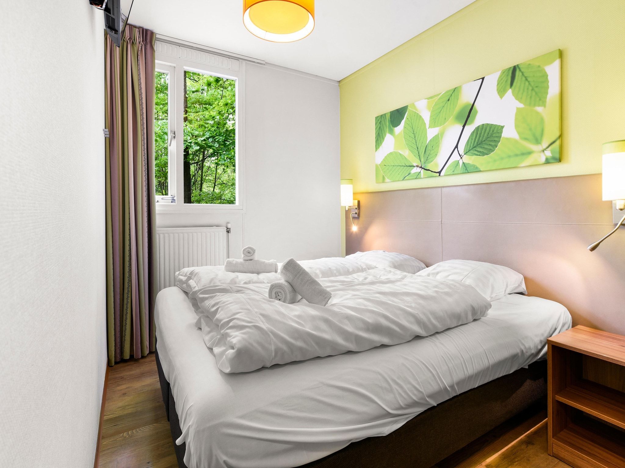 Een slaapkamer van Parc Heihaas 7 in Putten