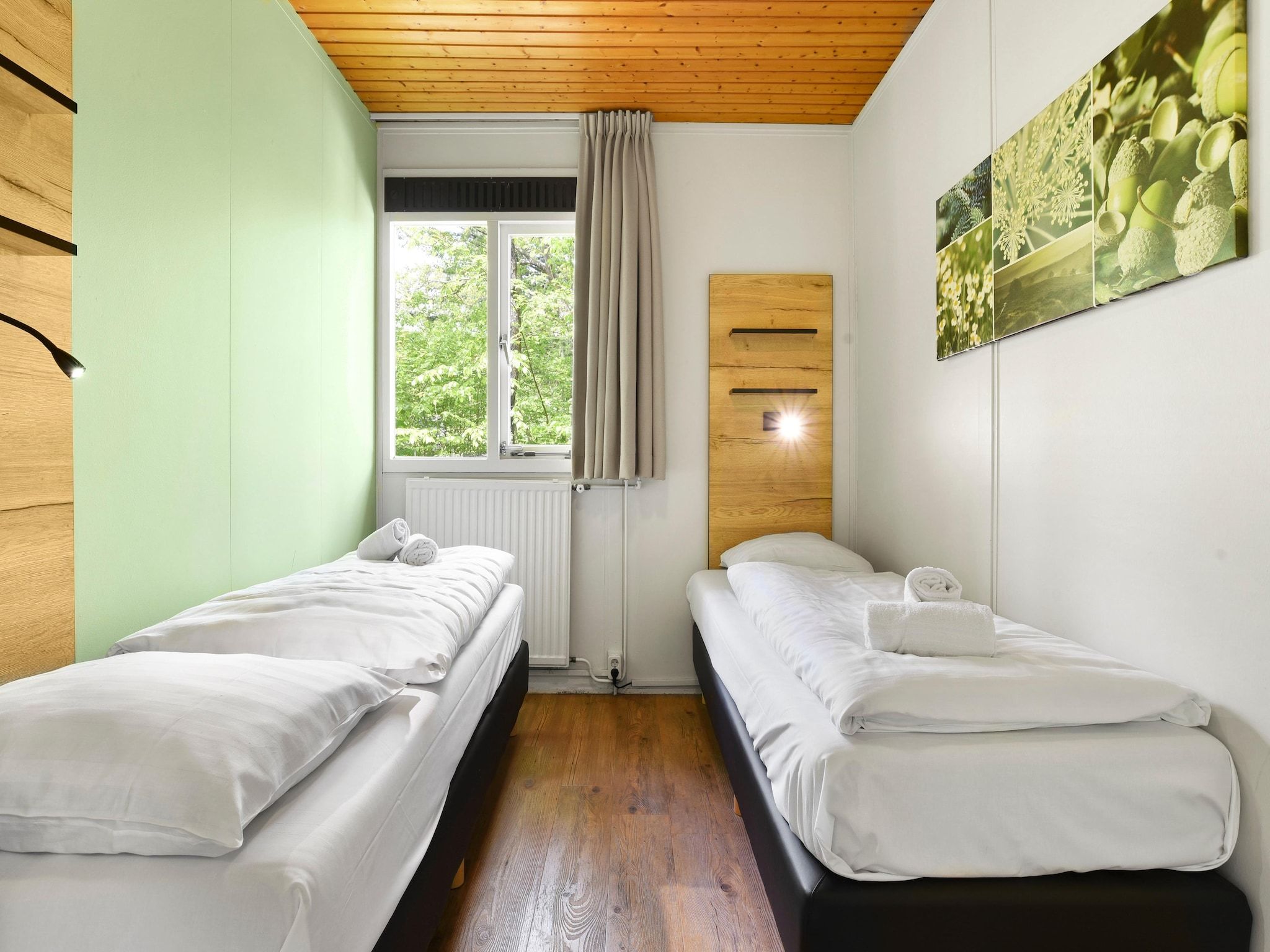 Een slaapkamer van Parc Heihaas 9 in Putten