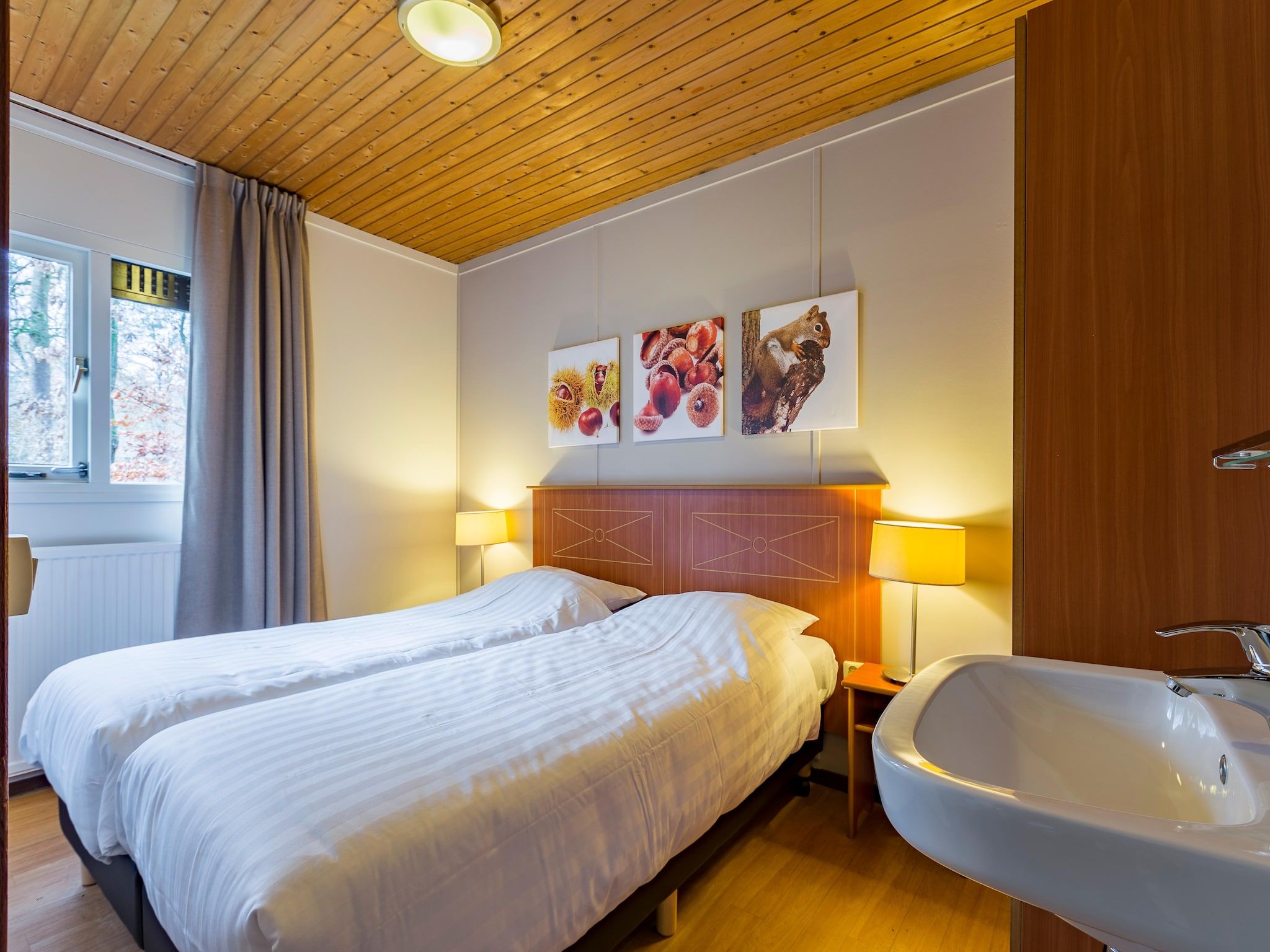 Een slaapkamer van Parc Heihaas 9 in Putten