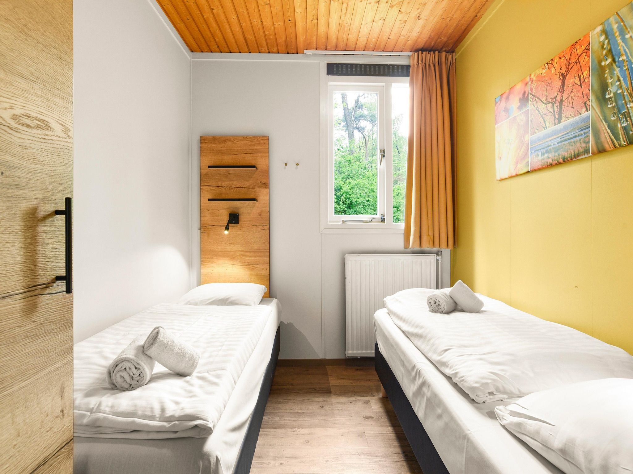 Een slaapkamer van Parc Heihaas 11 in Putten