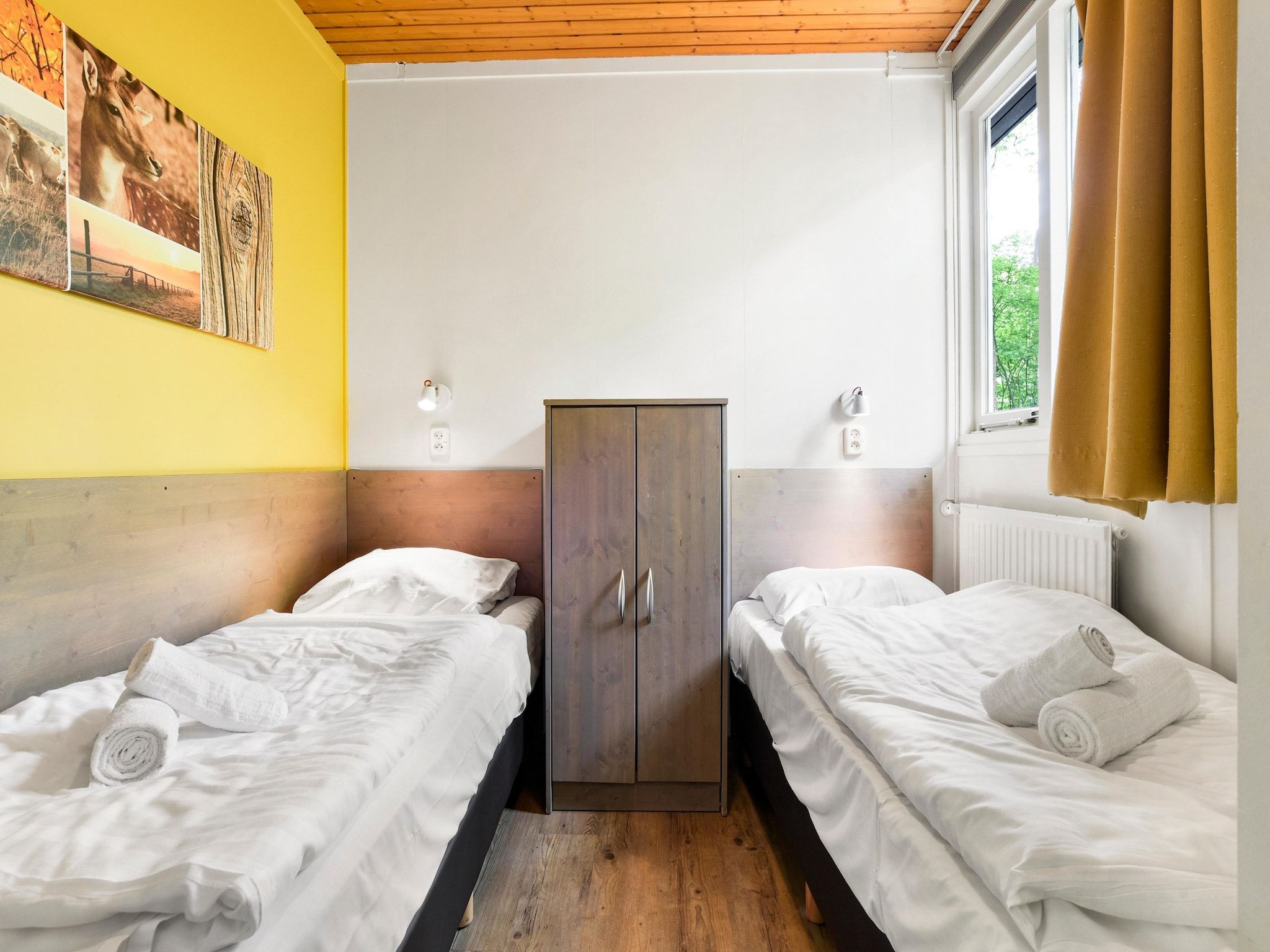 Een slaapkamer van Parc Heihaas 13 in Putten