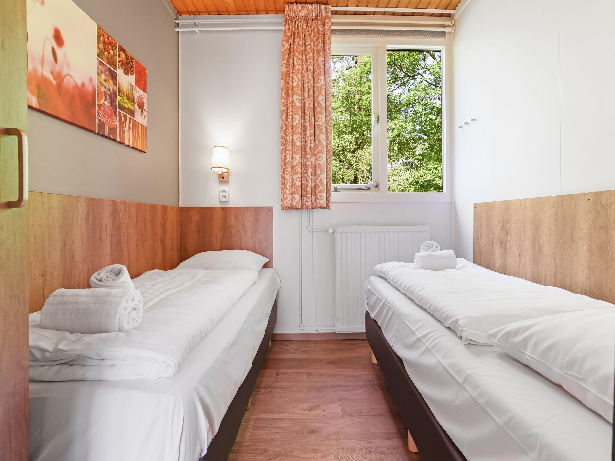 Een slaapkamer van Parc Heihaas 14 in Putten