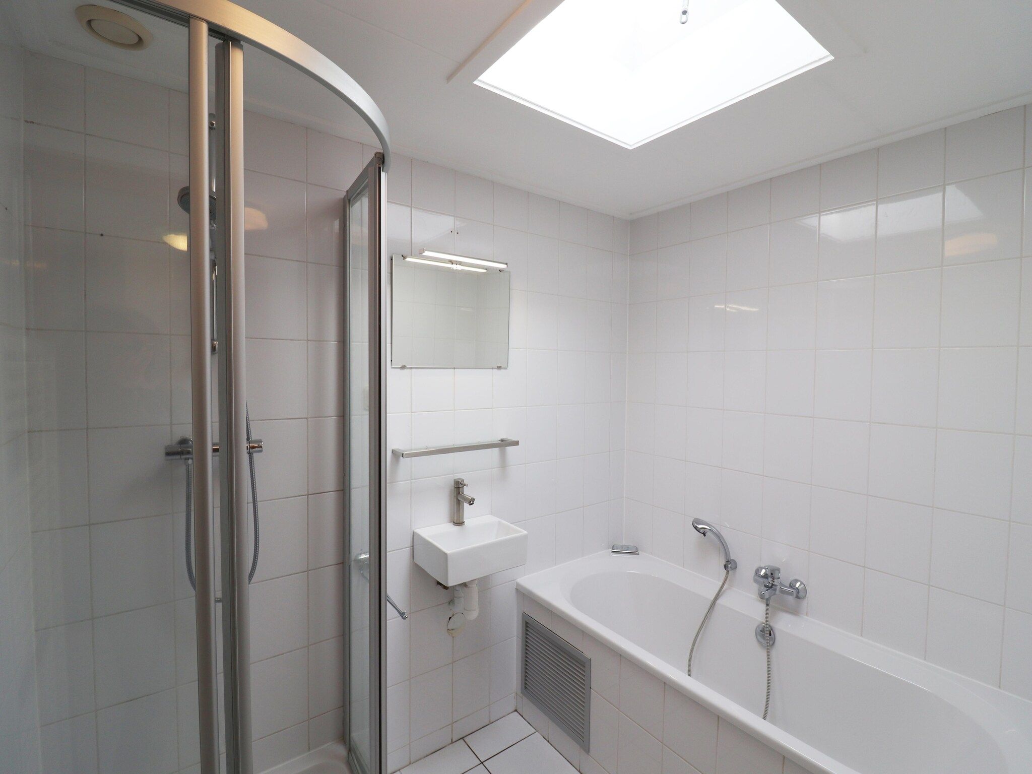 De badkamer van Golfvilla 38 comfort in Hollum