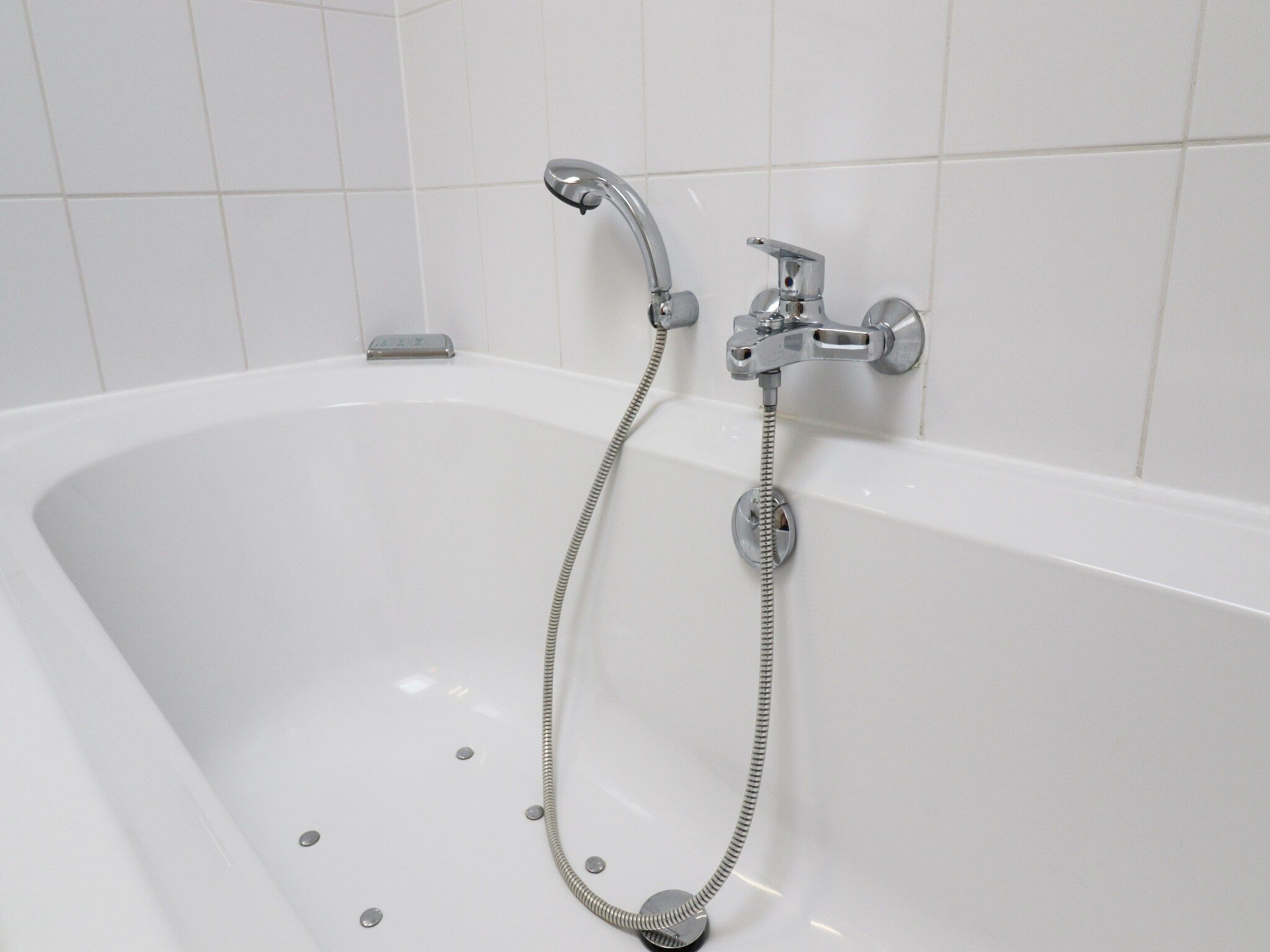 De badkamer van Golfvilla 38 comfort in Hollum