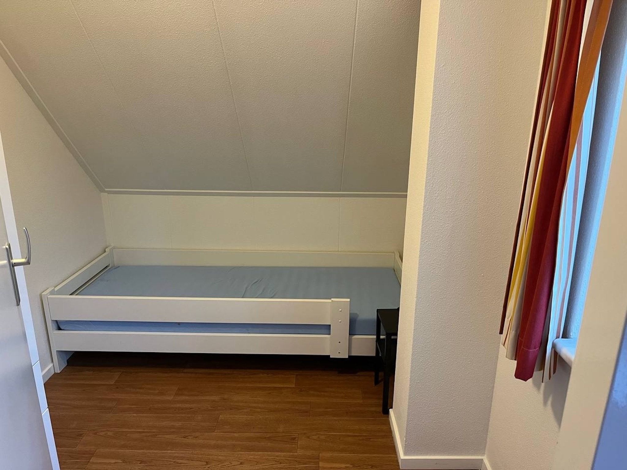 Een slaapkamer van Vakantiepark Hellendoorn 6 in Hellendoorn