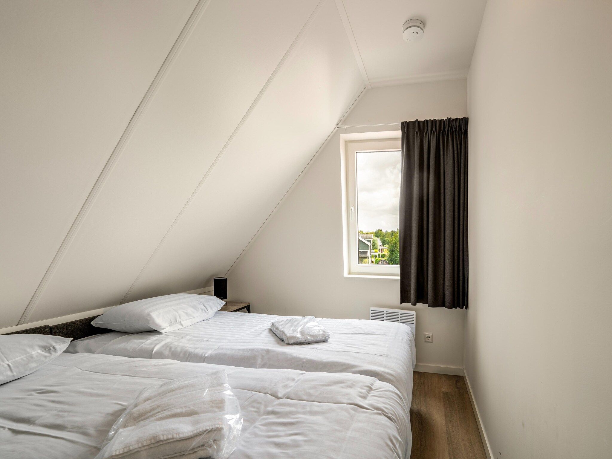 Een slaapkamer van Kuifduiker 115 in Simonshaven