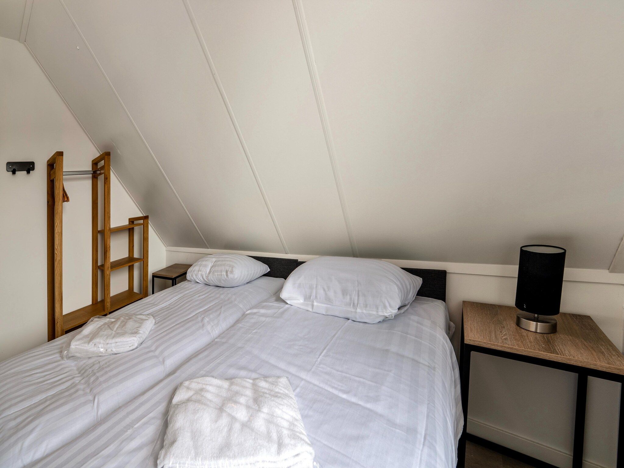 Een slaapkamer van Kuifduiker 115 in Simonshaven