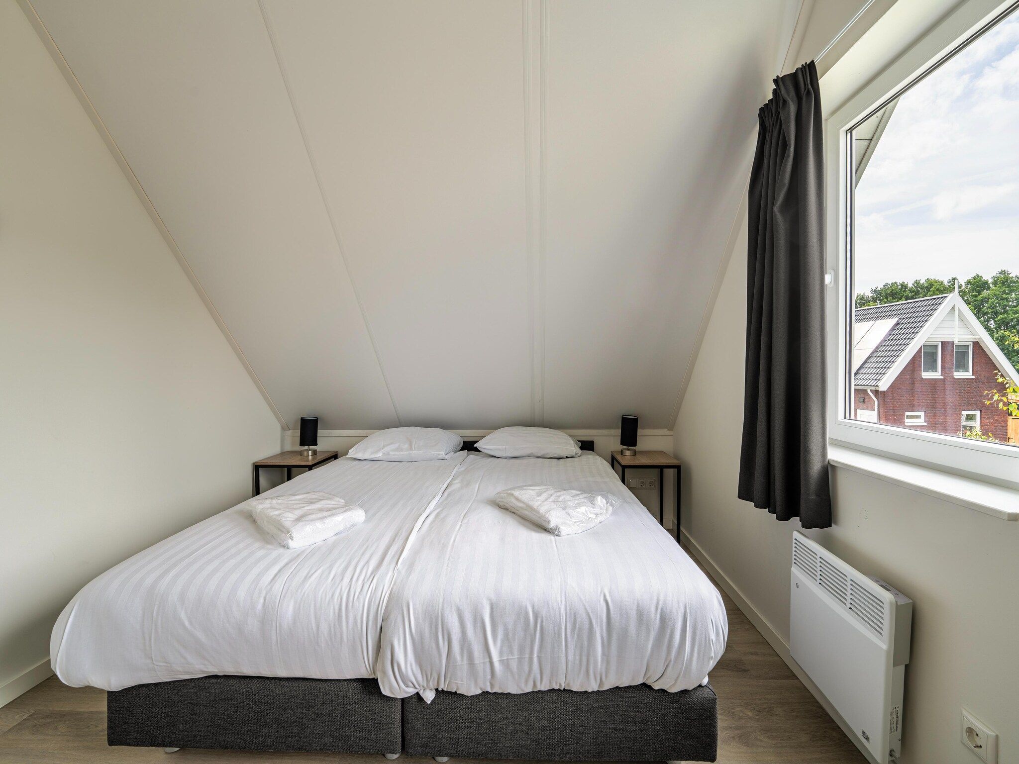 Een slaapkamer van Kuifduiker 115 in Simonshaven