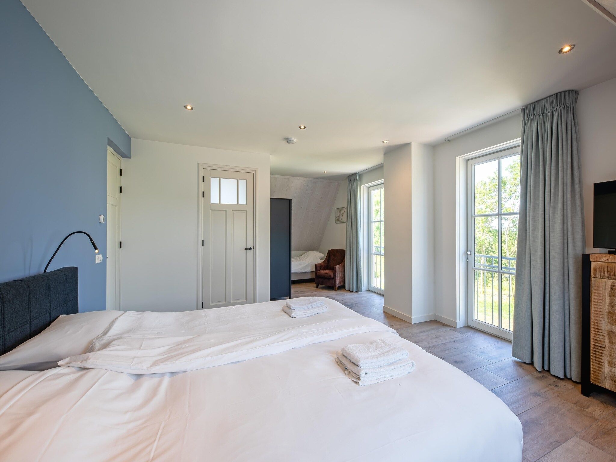 Een slaapkamer van Familievilla Nieuw-Zeeland in Oosterend