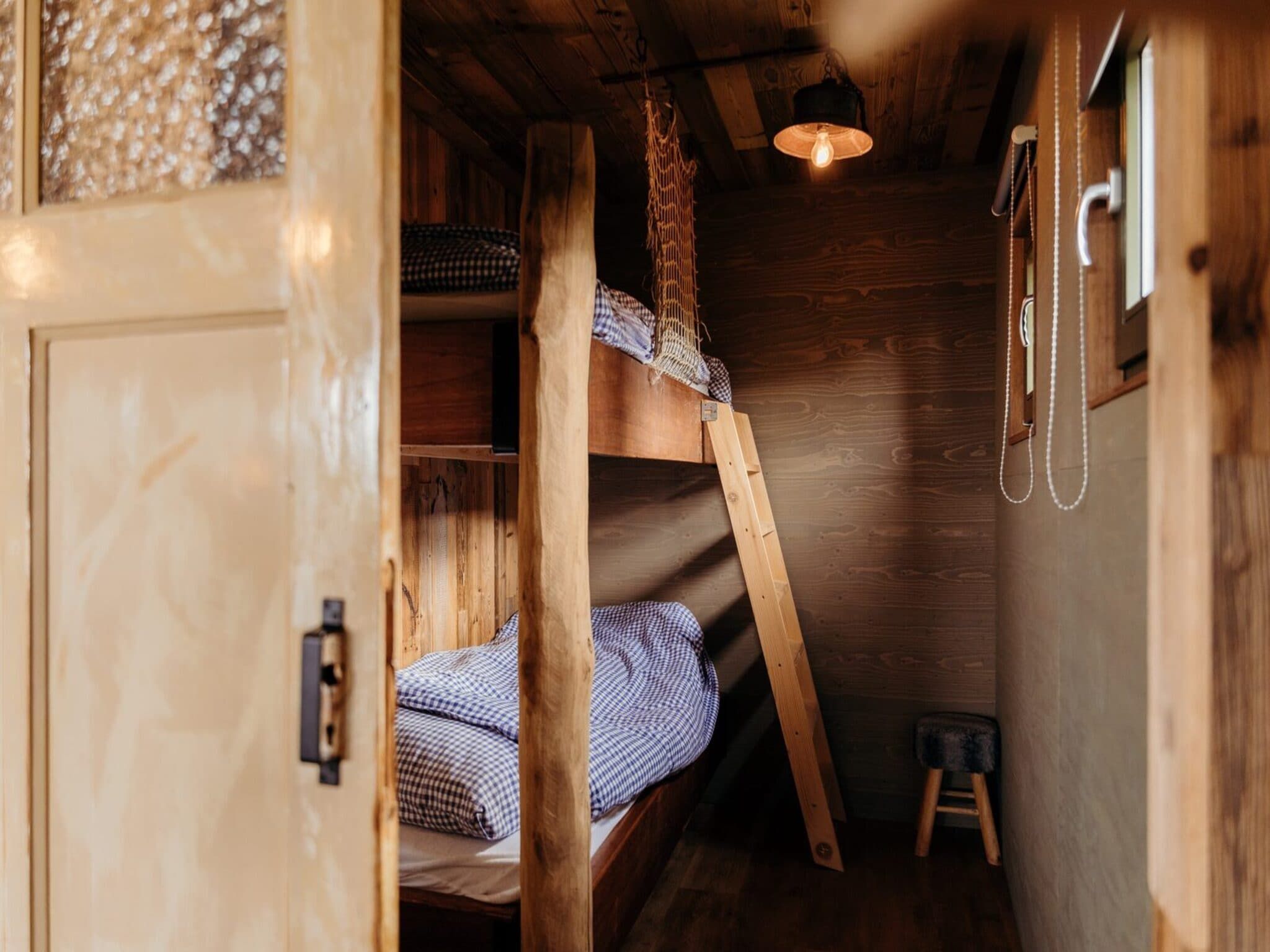 Een slaapkamer van Juttershut Duynpark - Callantsoog in Callantsoog