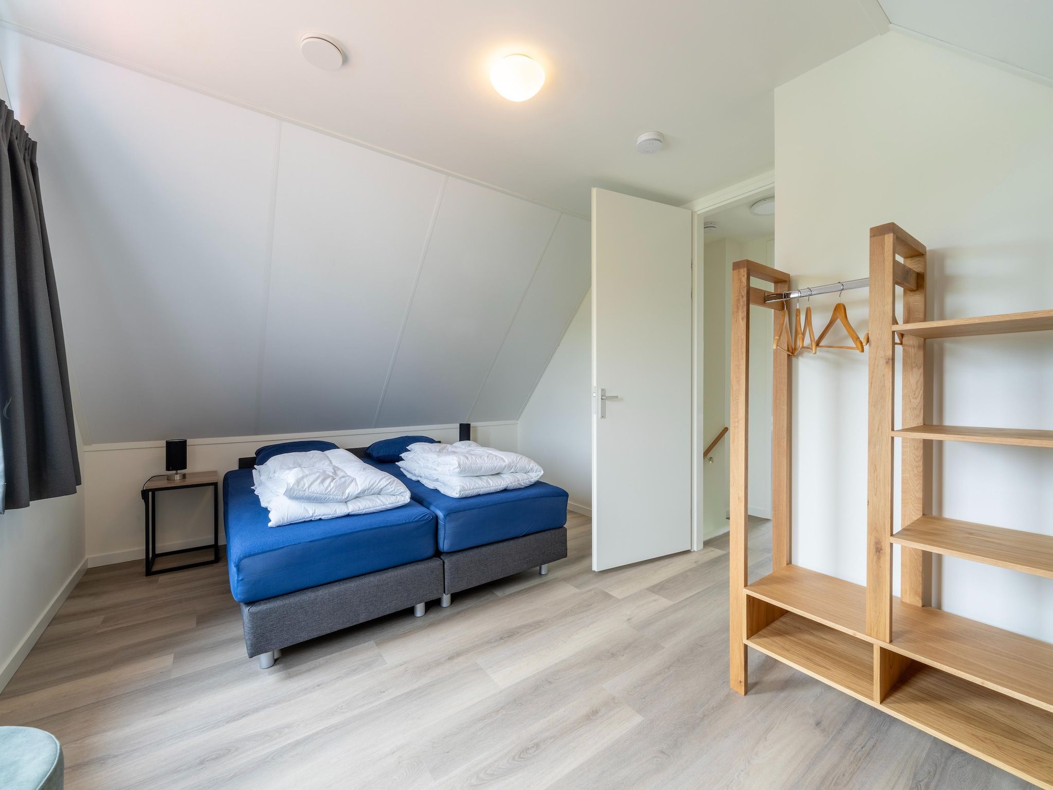 Een slaapkamer van Kuifduiker 122 in Simonshaven