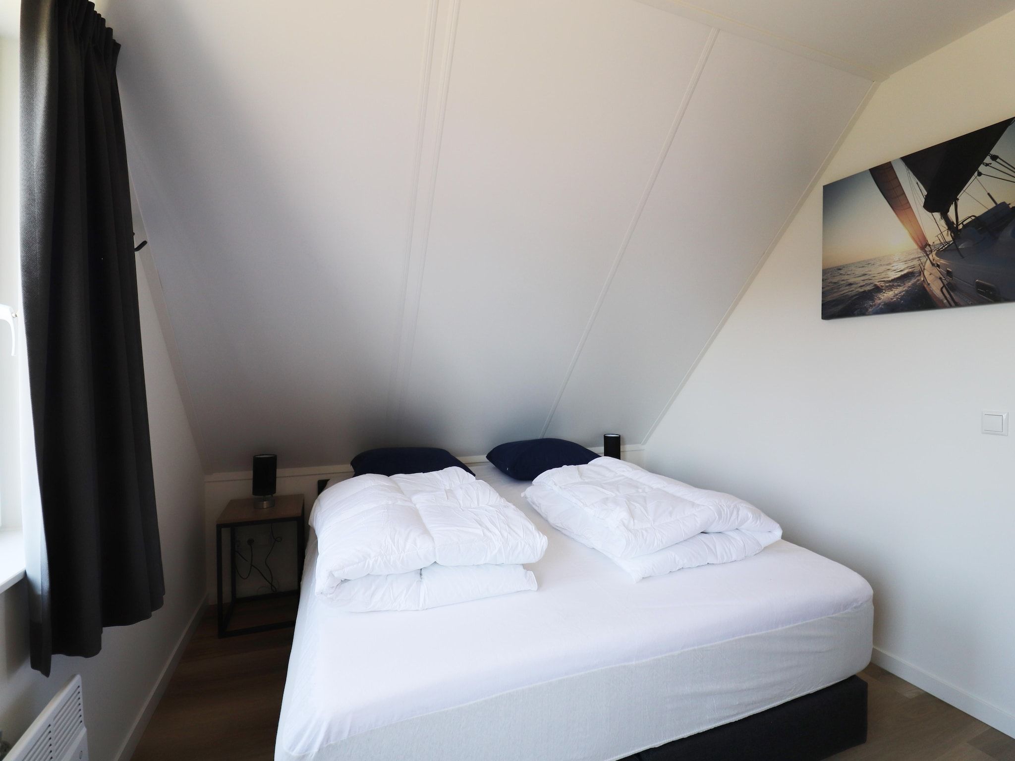 Een slaapkamer van Kuifduiker 122 in Simonshaven