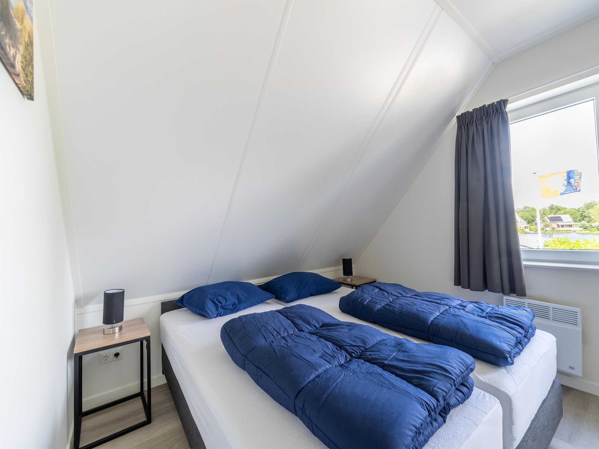 Een slaapkamer van Kuifduiker 5 in Simonshaven