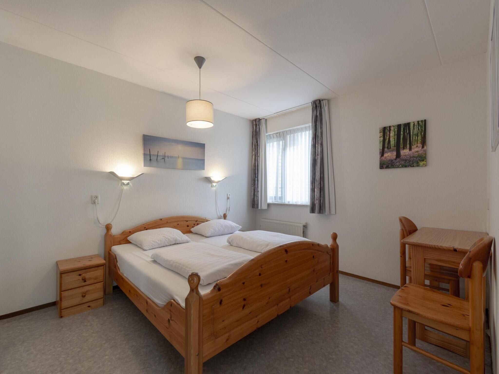 Een slaapkamer van Ooghduyne 148 in Julianadorp aan Zee