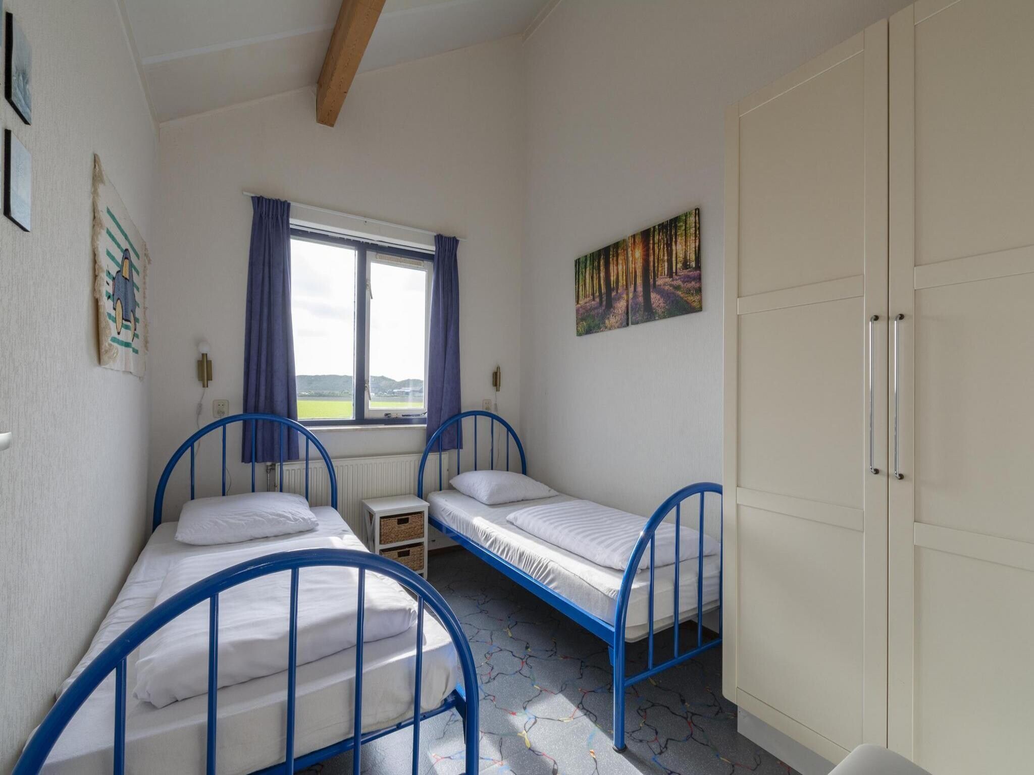 Een slaapkamer van Ooghduyne 148 in Julianadorp aan Zee