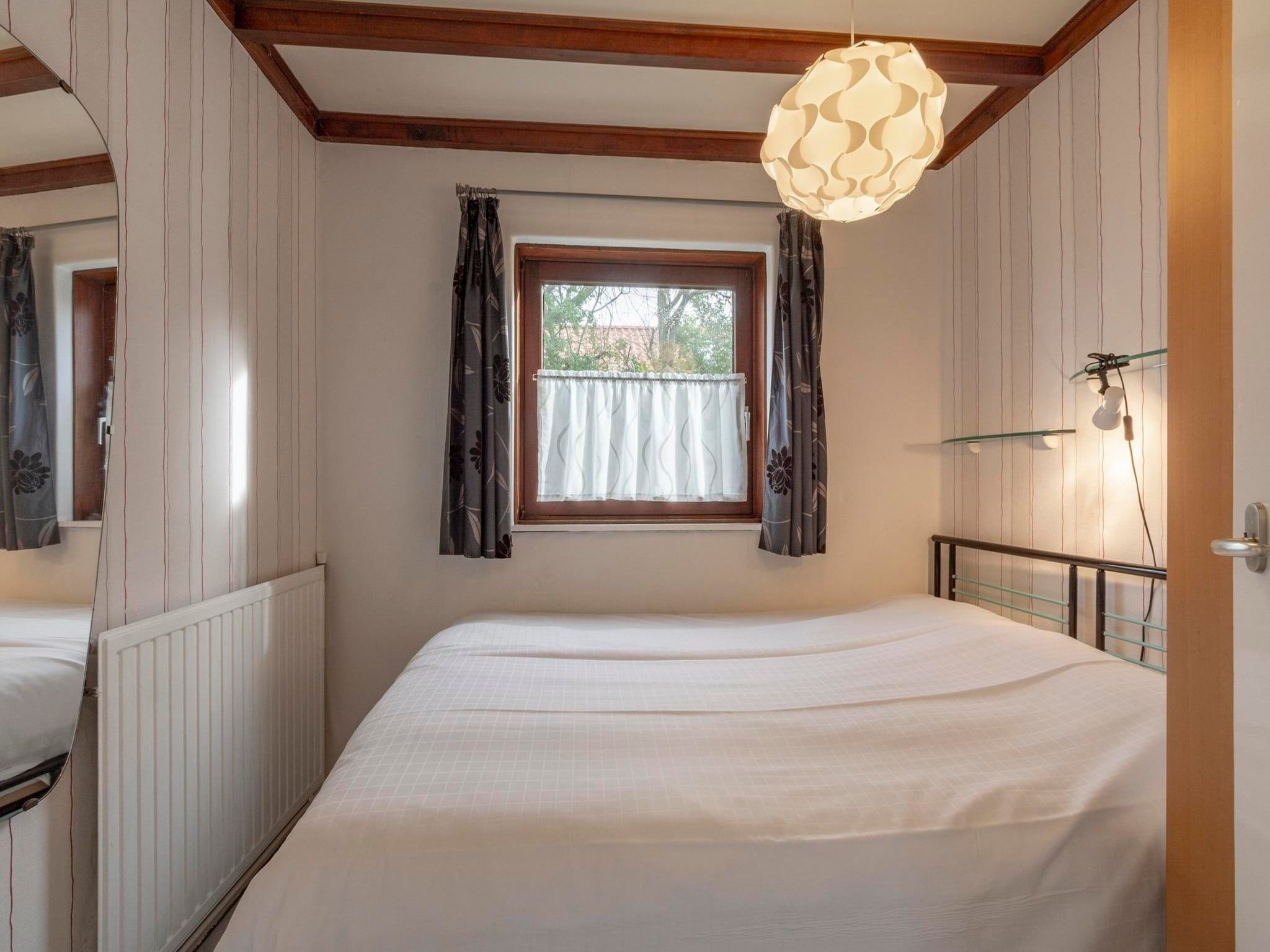 Een slaapkamer van Orchis 4 in Julianadorp aan Zee