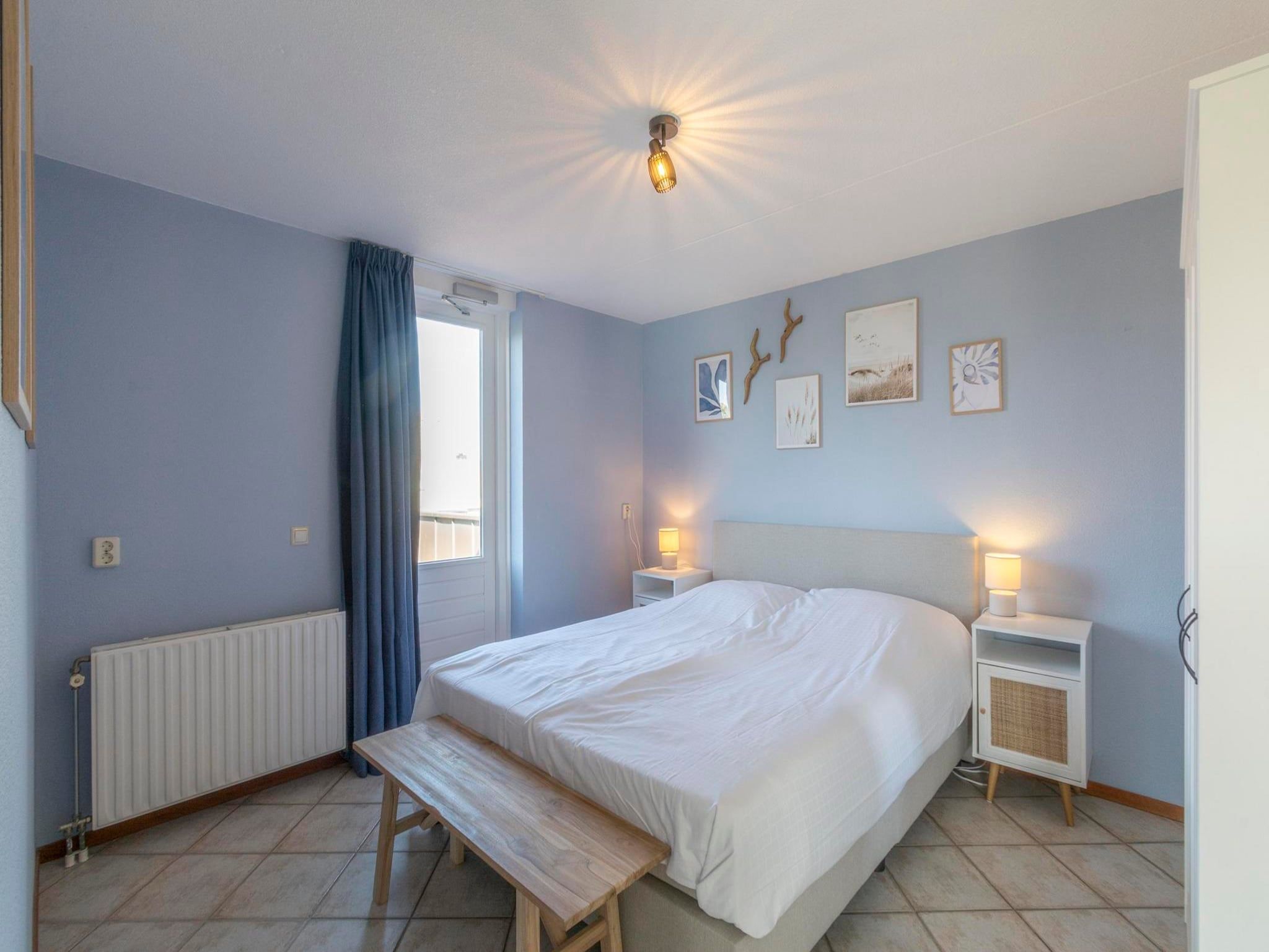 Een slaapkamer van Wijde Blick 311 in Callantsoog
