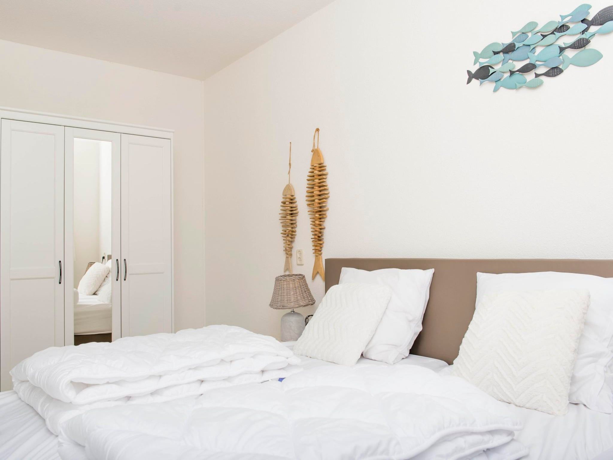 Een slaapkamer van Résidence Juliana 14 in Julianadorp aan Zee