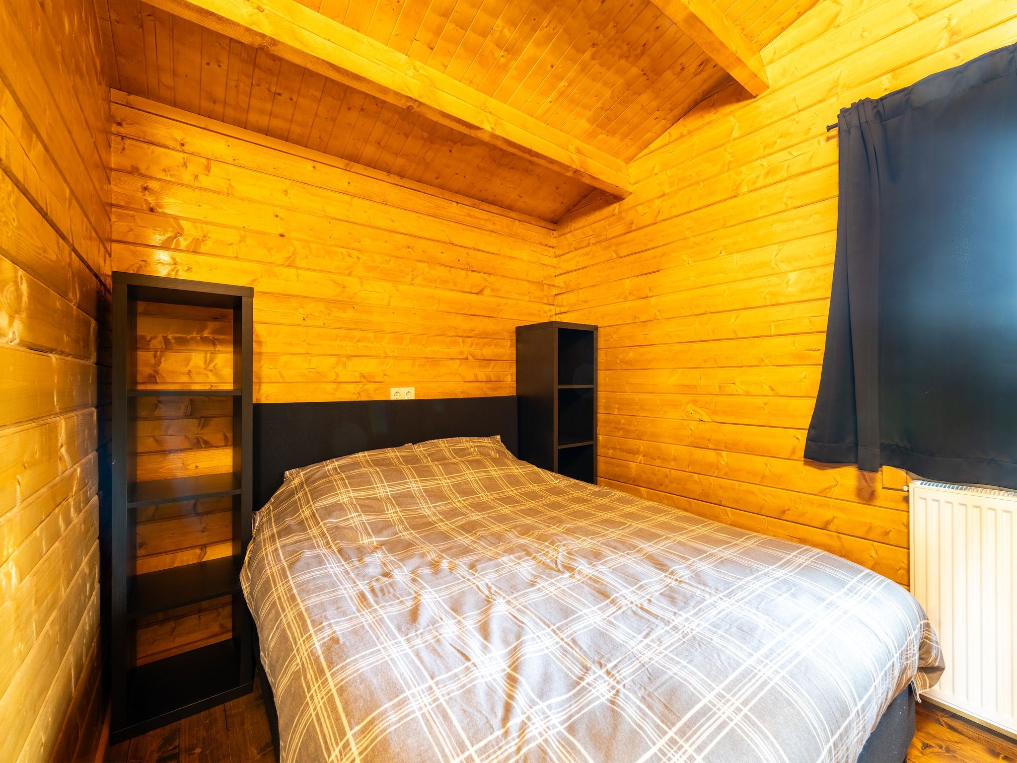 Een slaapkamer van Chalet Riga in Valkenswaard