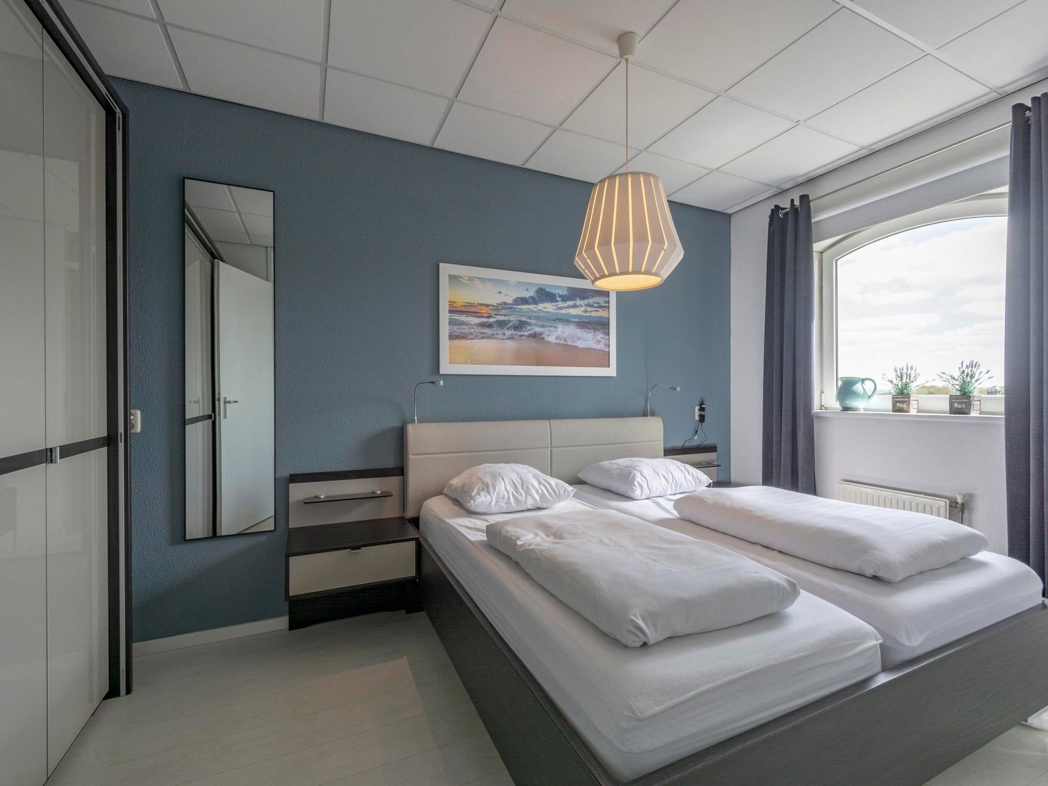 Een slaapkamer van Résidence Juliana 54 in Julianadorp aan Zee