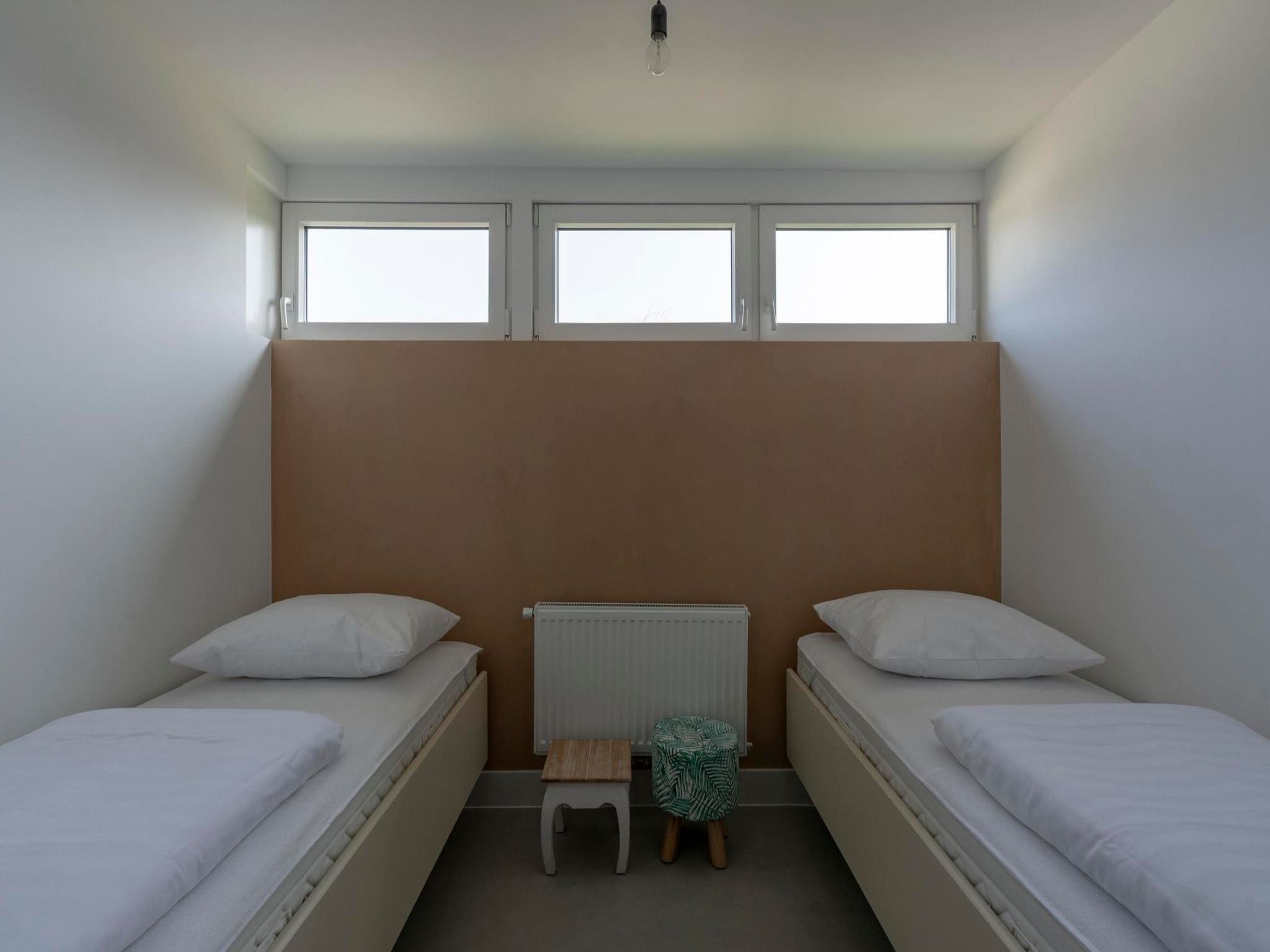 Een slaapkamer van Duinland 15 in Sint Maartenszee