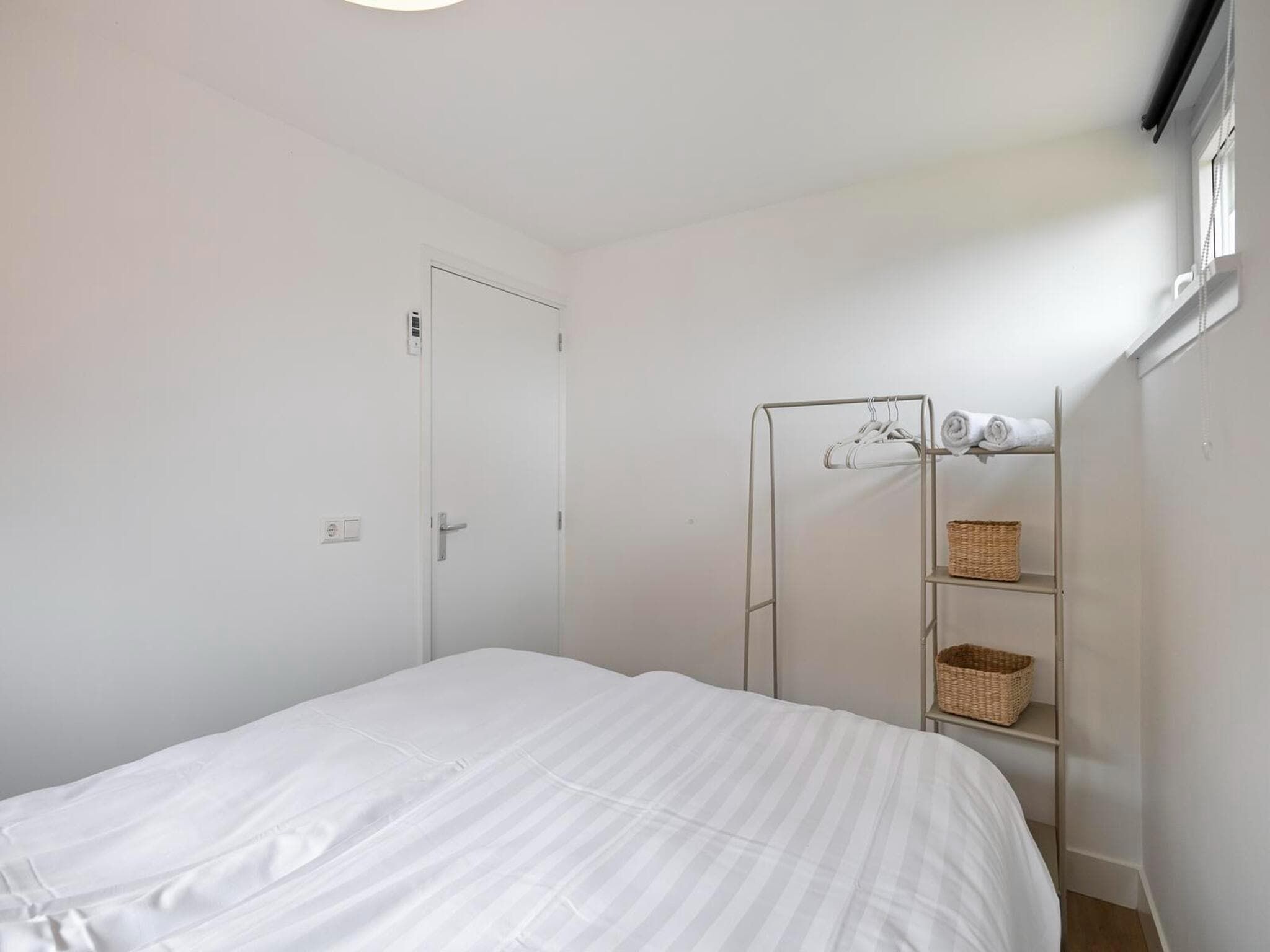Een slaapkamer van Duinland 15 in Sint Maartenszee