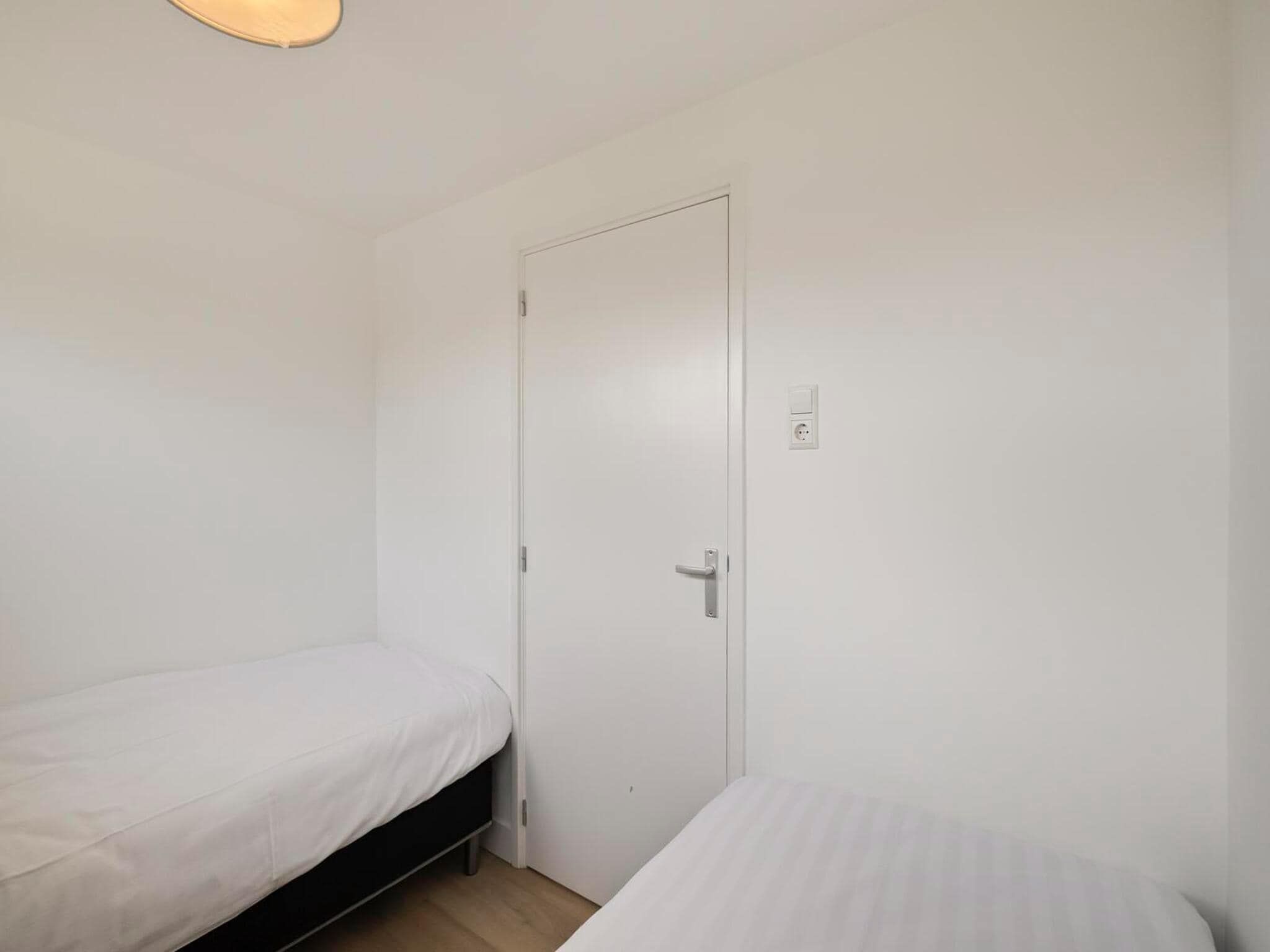 Een slaapkamer van Duinland 15 in Sint Maartenszee