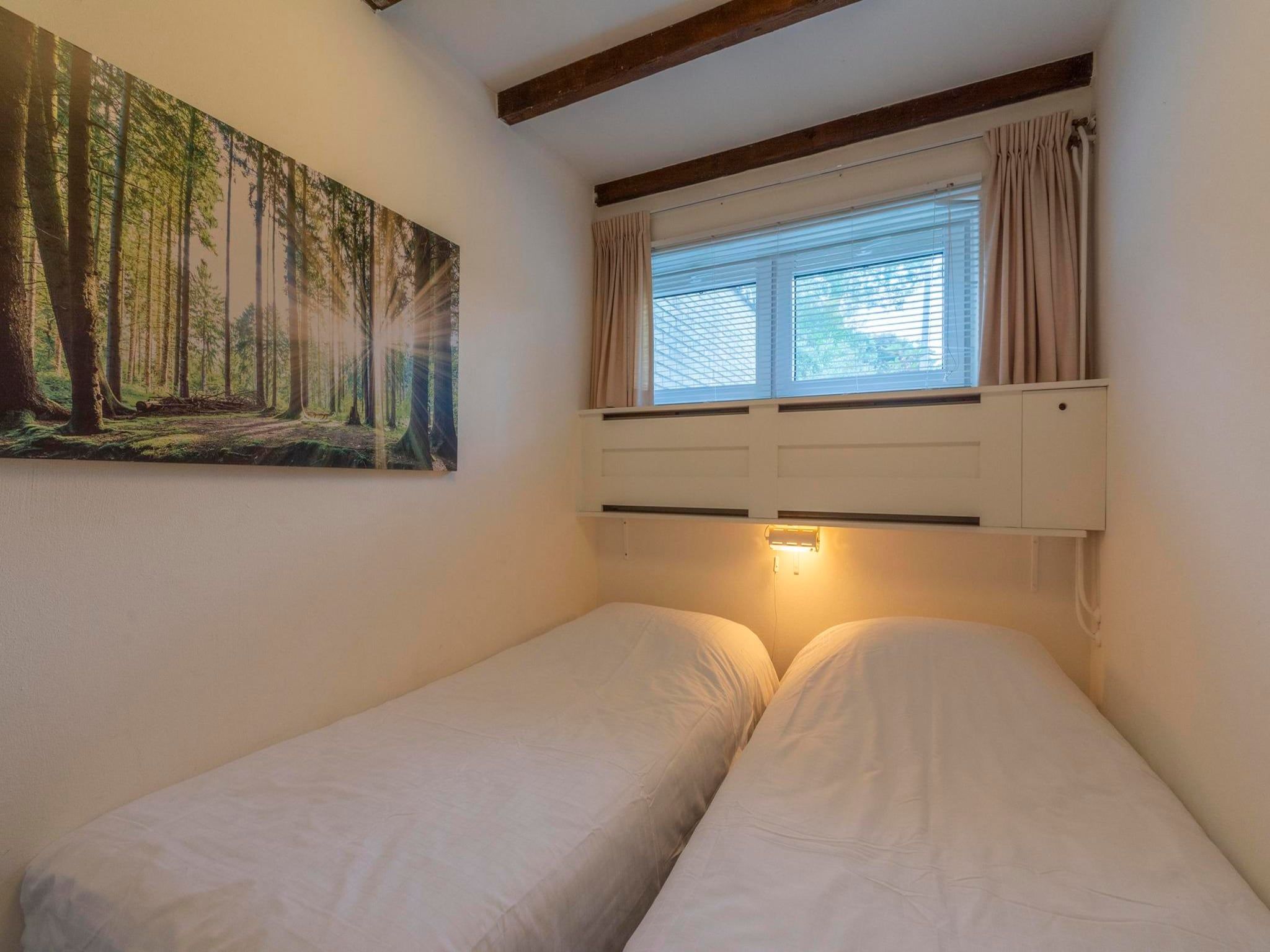 Een slaapkamer van Duinland 197 in Sint Maartenszee