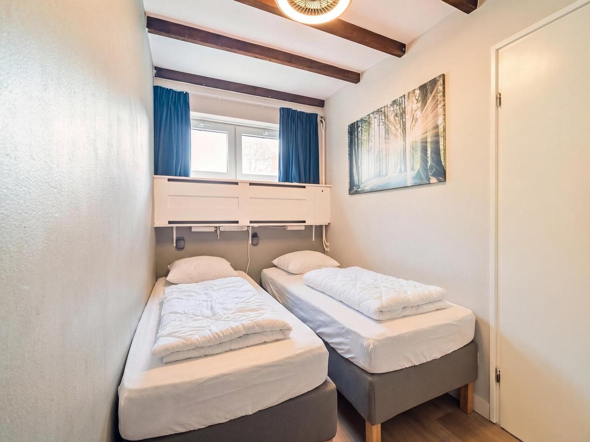 Een slaapkamer van Duinland 197 in Sint Maartenszee