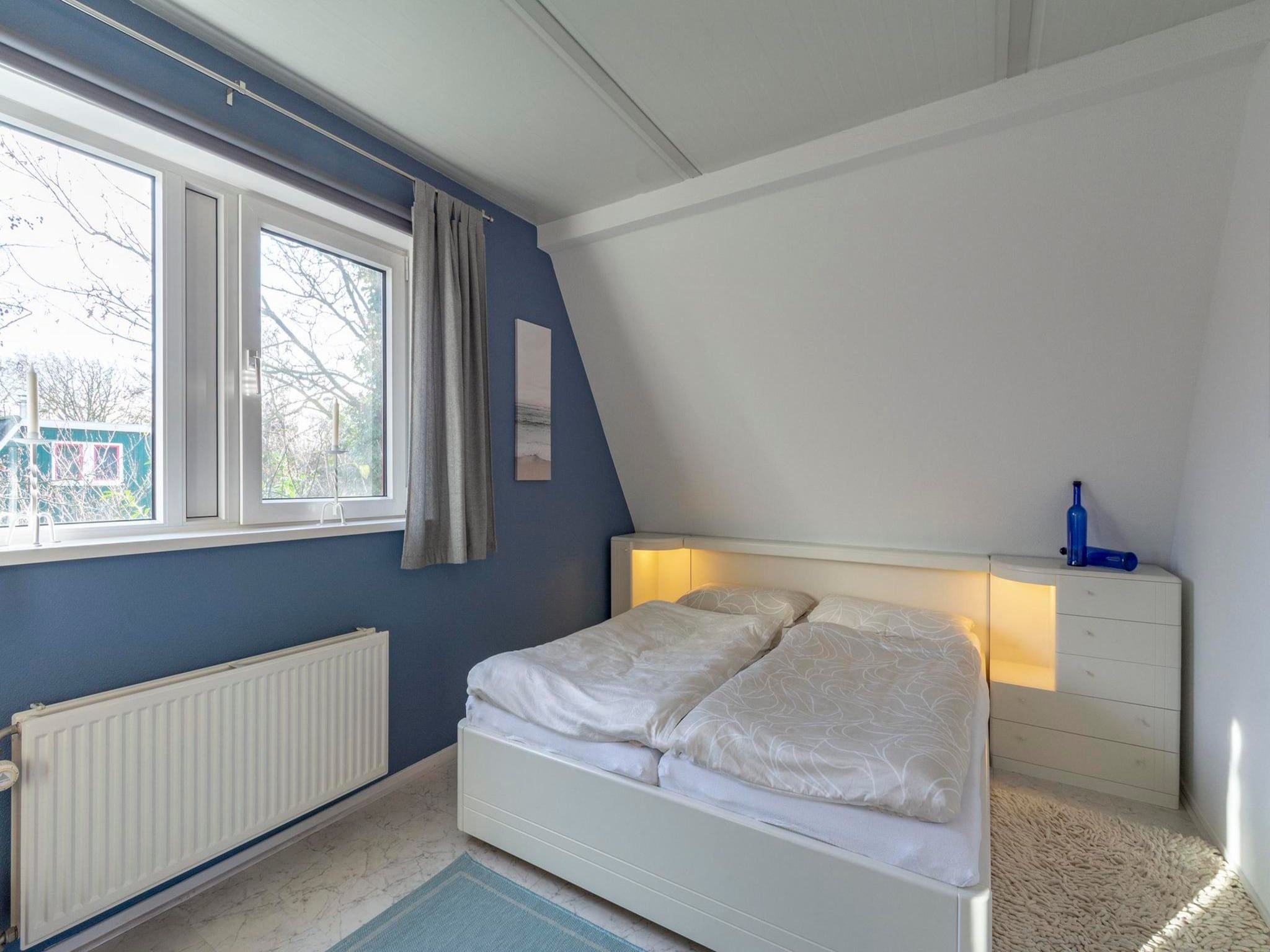Een slaapkamer van Campanula 39 in Sint Maartenszee